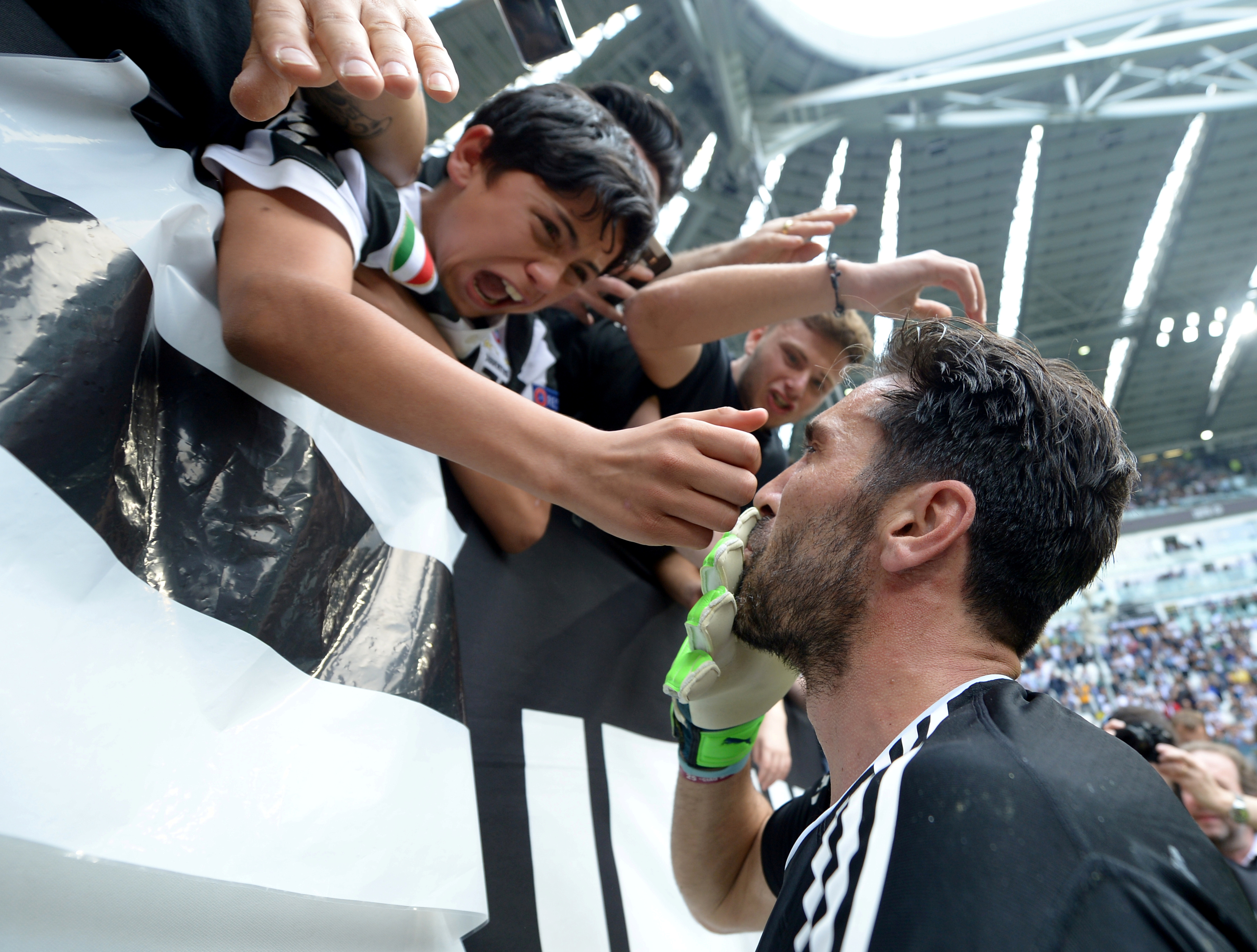 Gianluigi Buffon with fans before the match