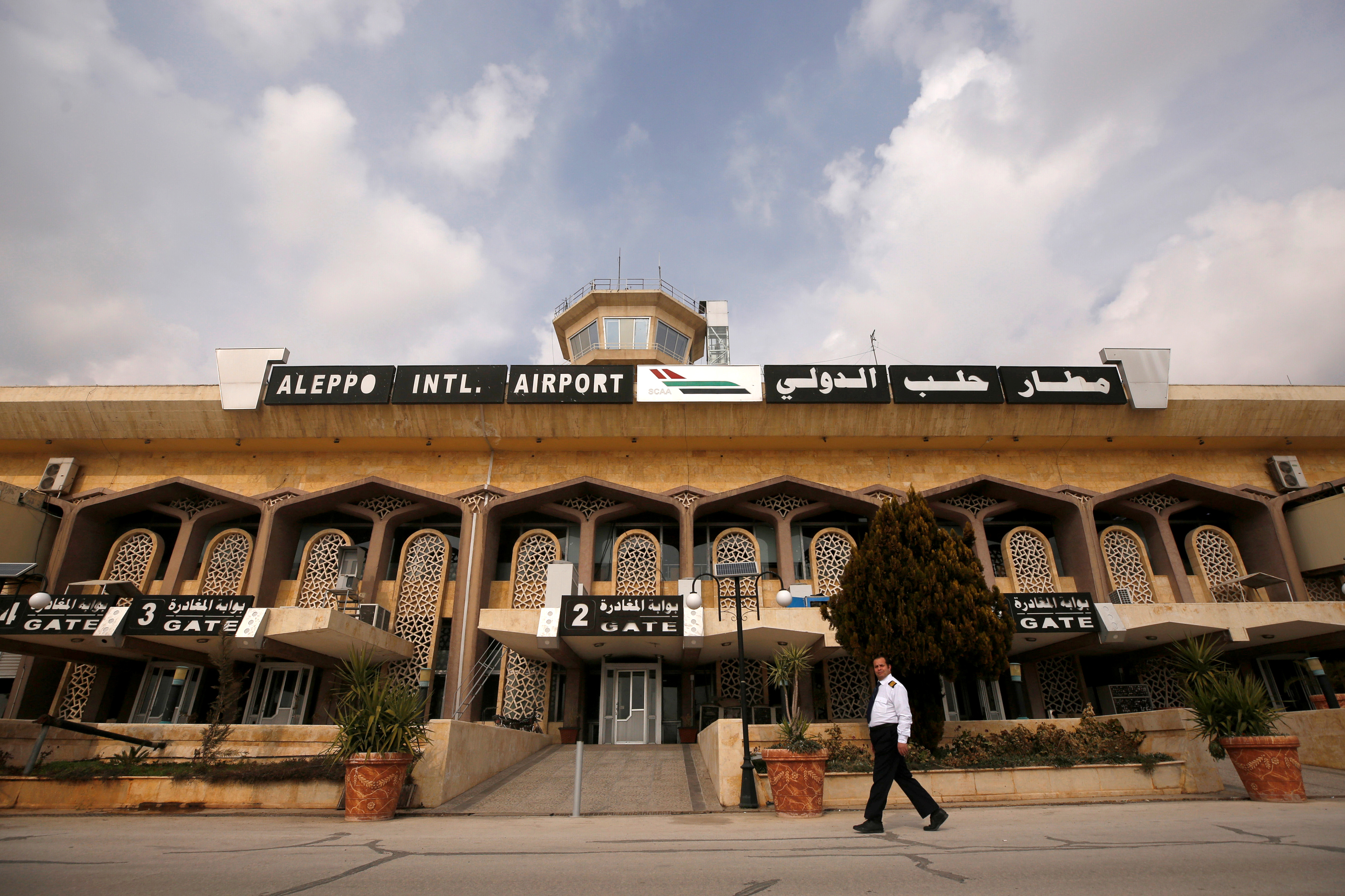 A man walks at Aleppo international airport