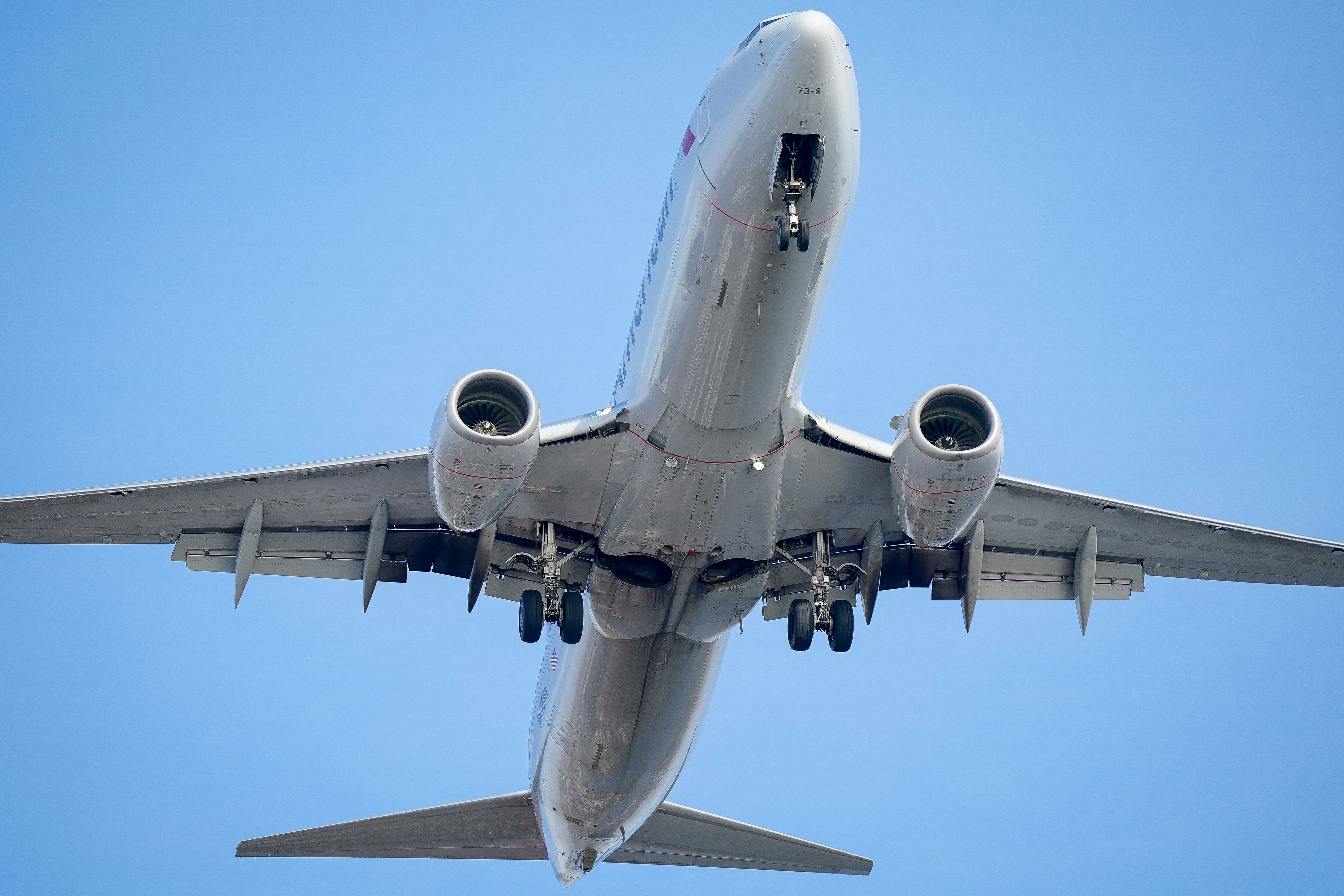 underbelly of plane flying overhead