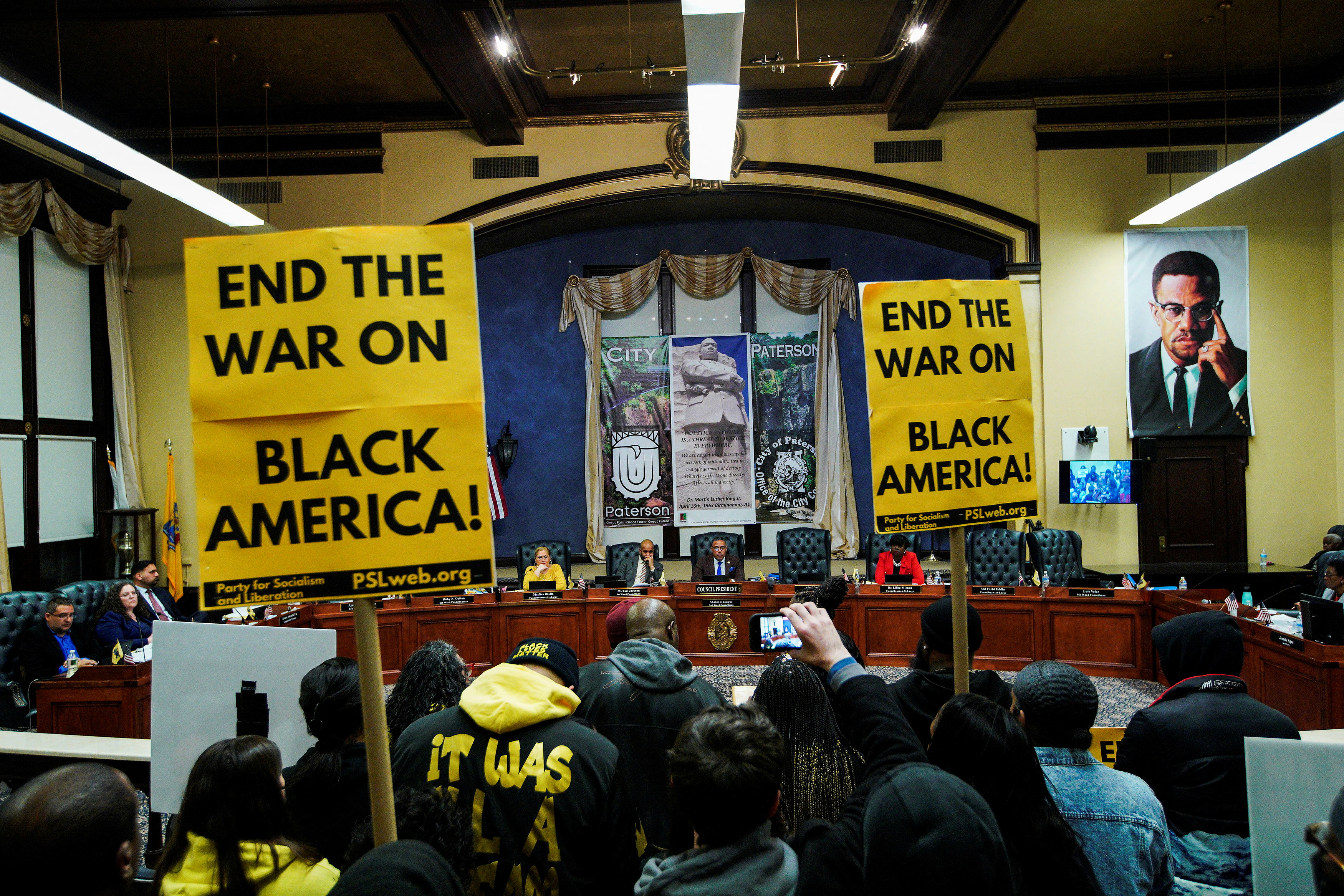 Members of Black Lives Matter and residents hold a protest in the City Hall, to demand the resignation of Paterson Mayor Andre Sayegh, following state attorney general takeover of police department in Paterson, New Jersey, U.S. March 28, 2023. REUTERS/Eduardo Munoz