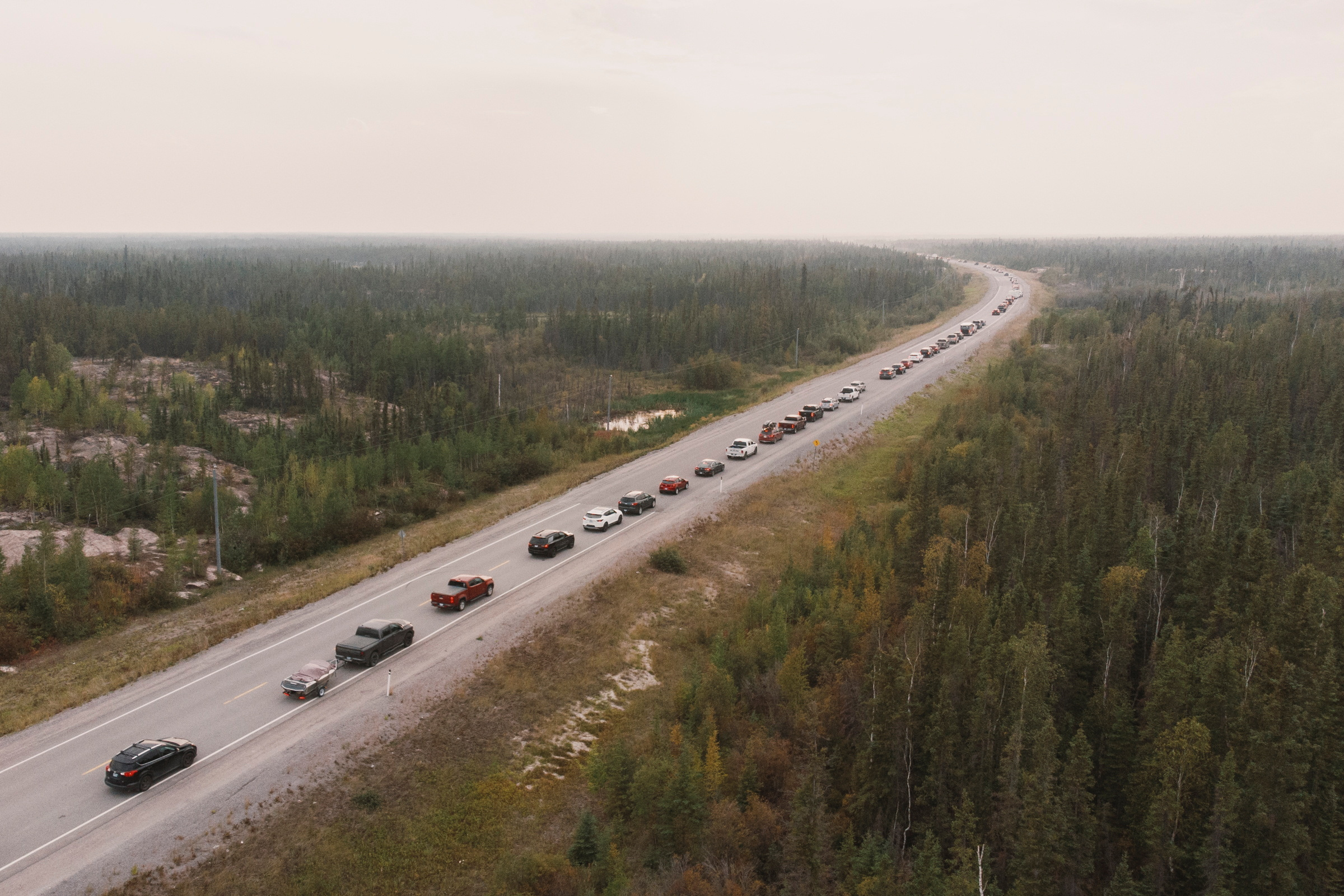 Yellowknife residents leave the city on Highway 3, the only highway in or out of the community, after an evacuation order was given due to the proximity of a wildfire in Yellowknife, Northwest Territories, Canada August 16, 2023. REUTERS/Pat Kane