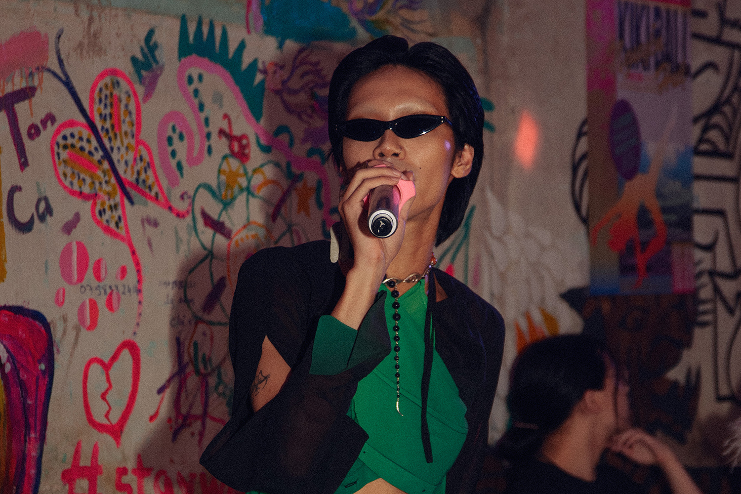 Ni Xinh, a DJ and ballroom commentator, emcees at the Nguyen Hue Kiki Ball [Courtesy of Ngo Tien Dat]