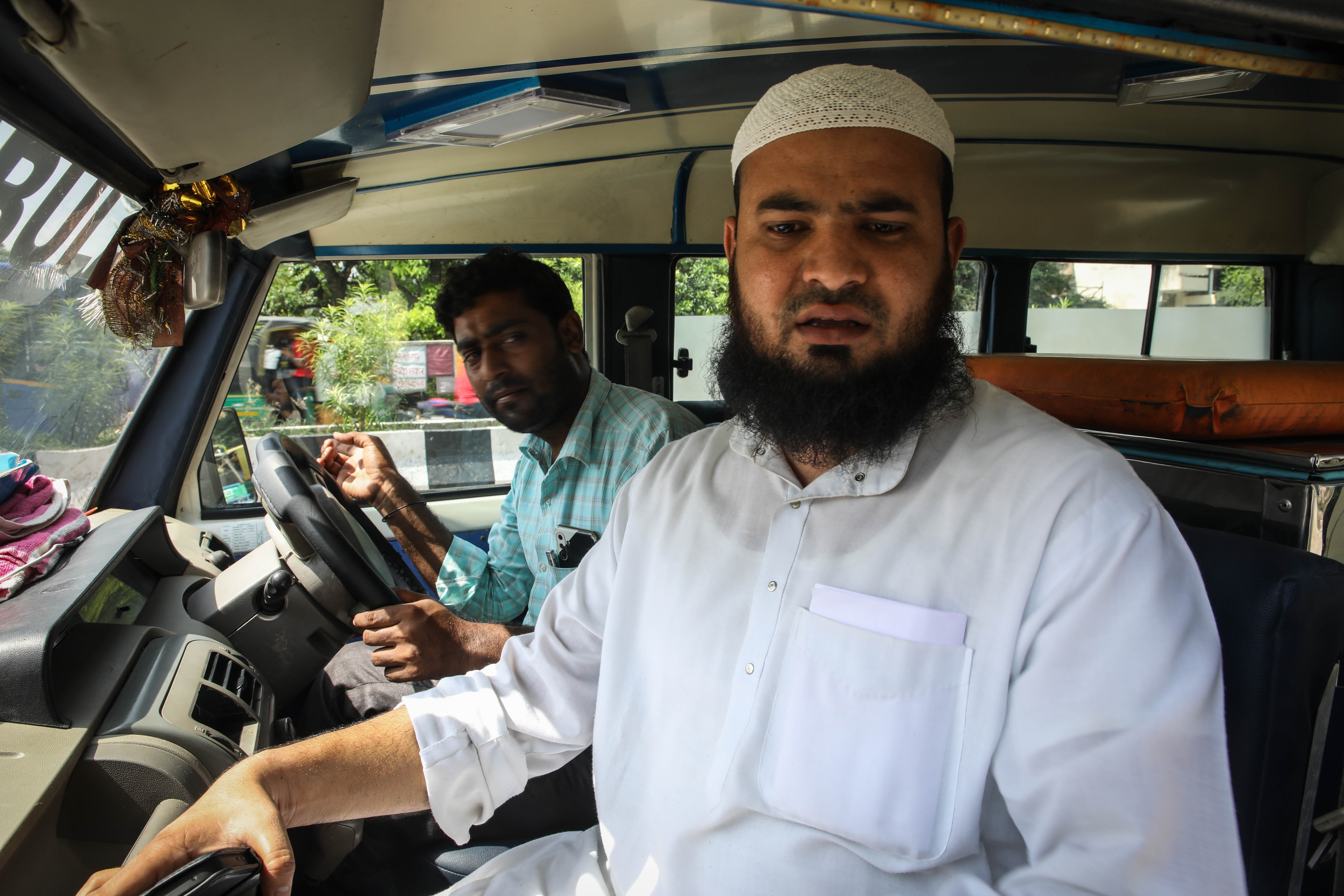 Shadab Anwar sits in an ambulance