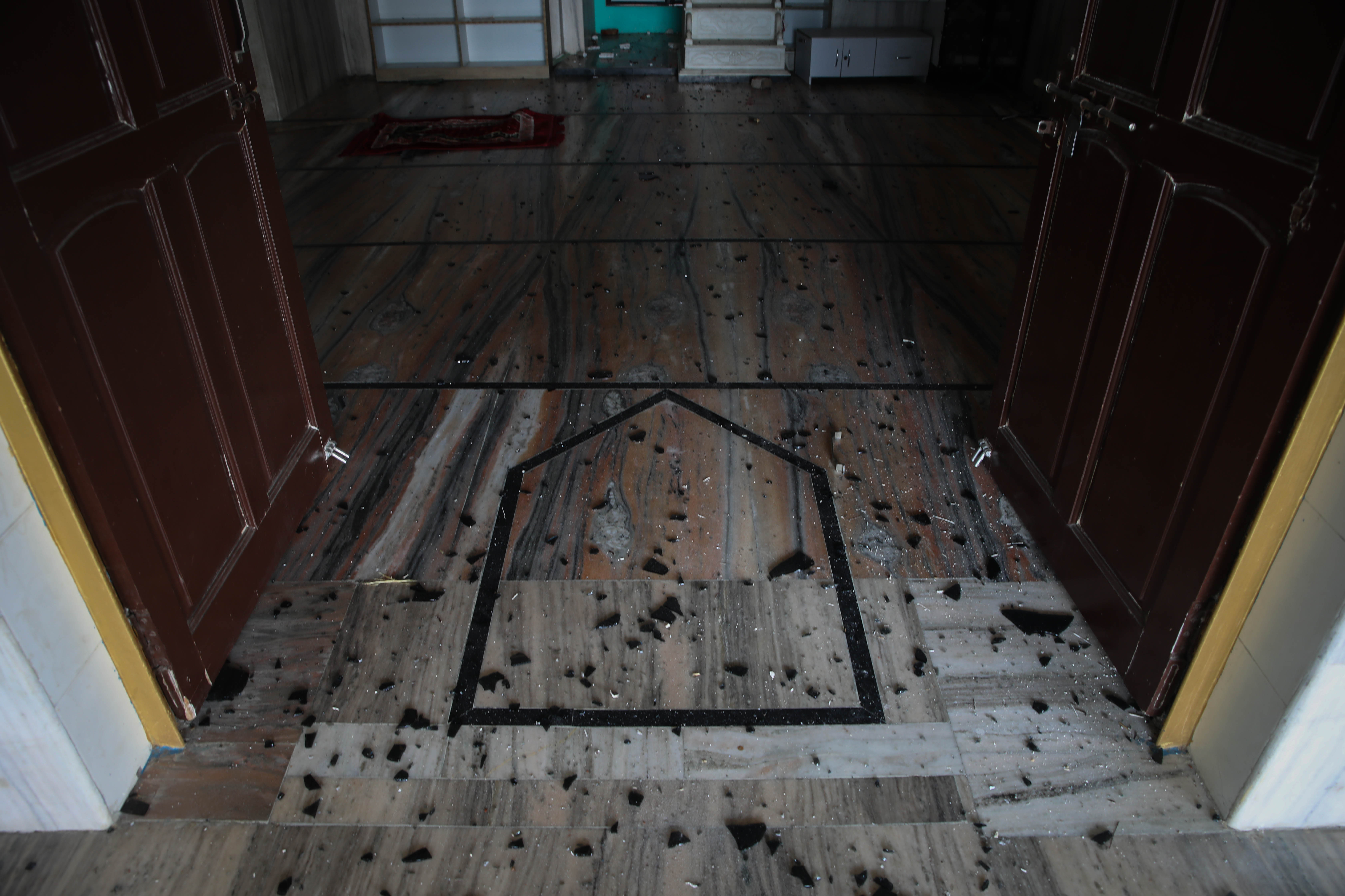 Glass shards scattered on the prayer floor of Shahi Jama Masjid