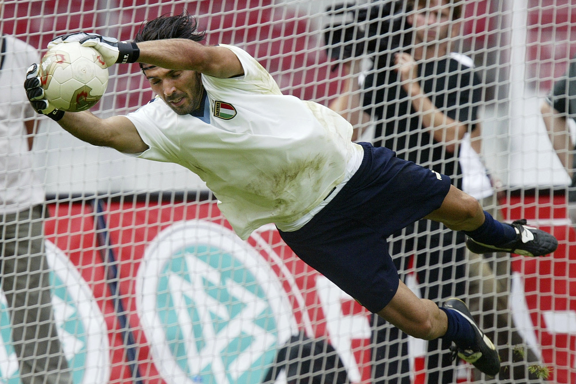 Gianluigi Buffon, goalkeeper of the Italian national soccer team, stretches for a ball