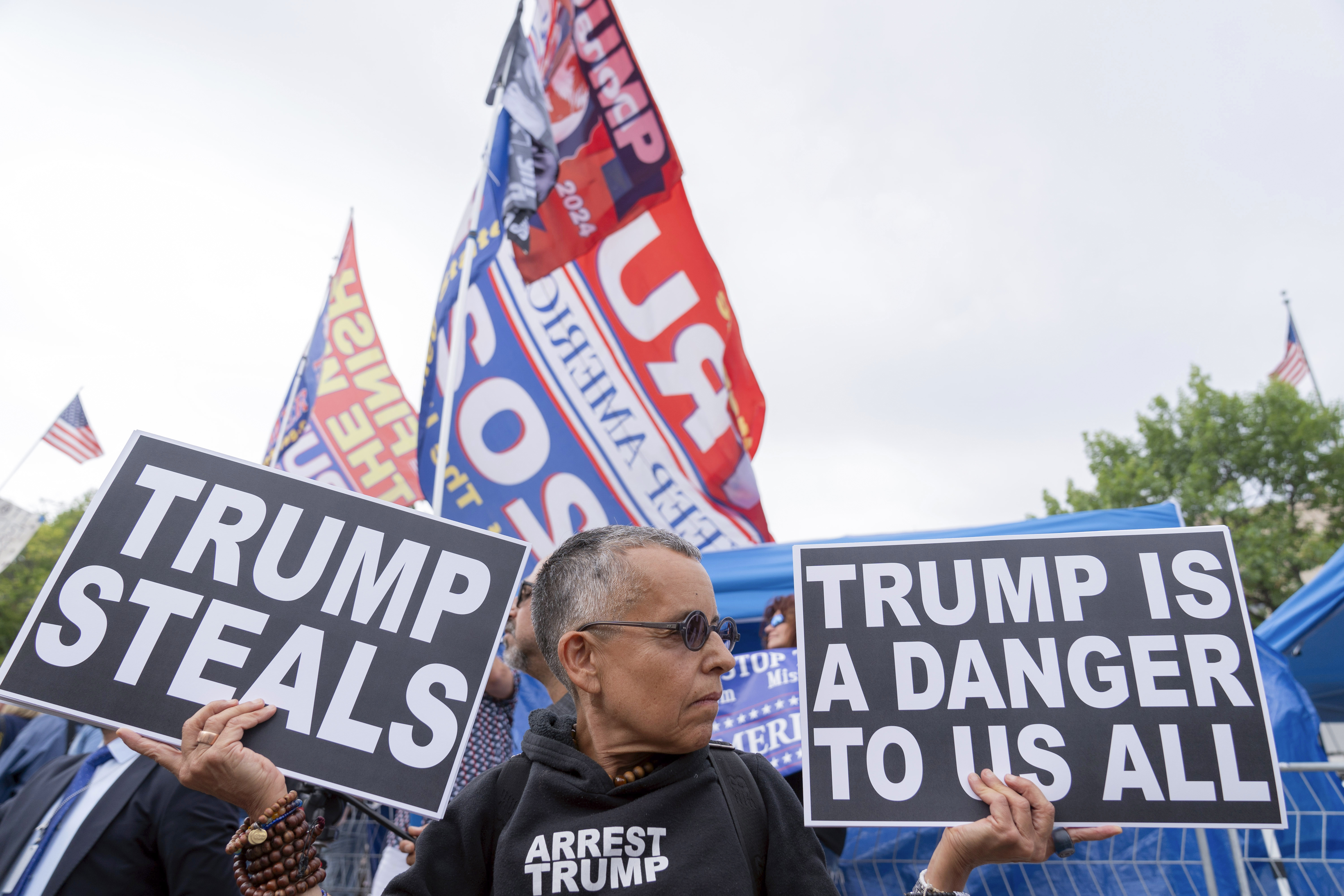 Trump critics and supporters rally outside the court in Washington, DC, August 3, 2023