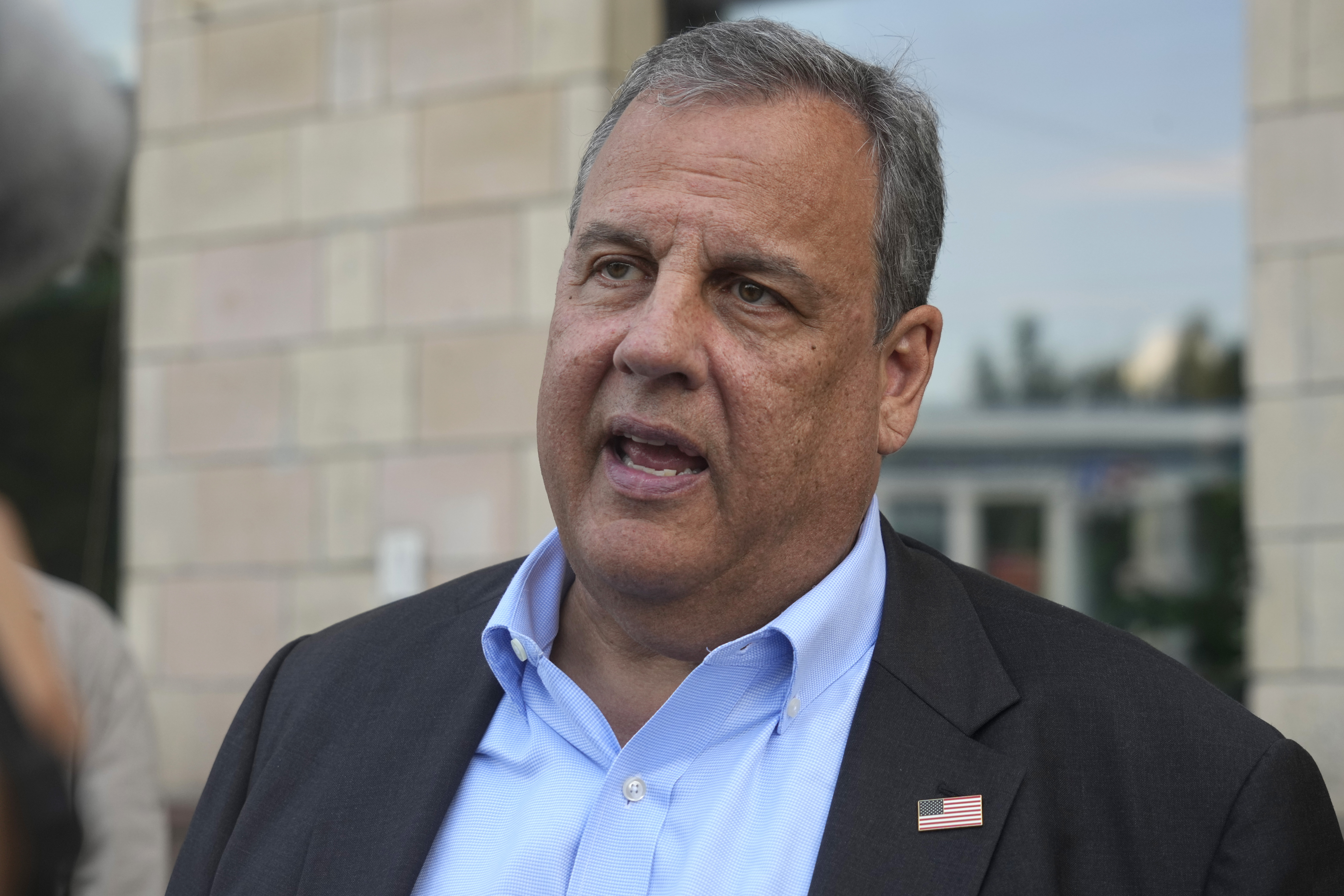 Republican presidential candidate former New Jersey Gov. Chris Christie speaks with reporters outside the Child Rights Protection Center in Kyiv, Ukraine, Friday, Aug. 4, 2023.