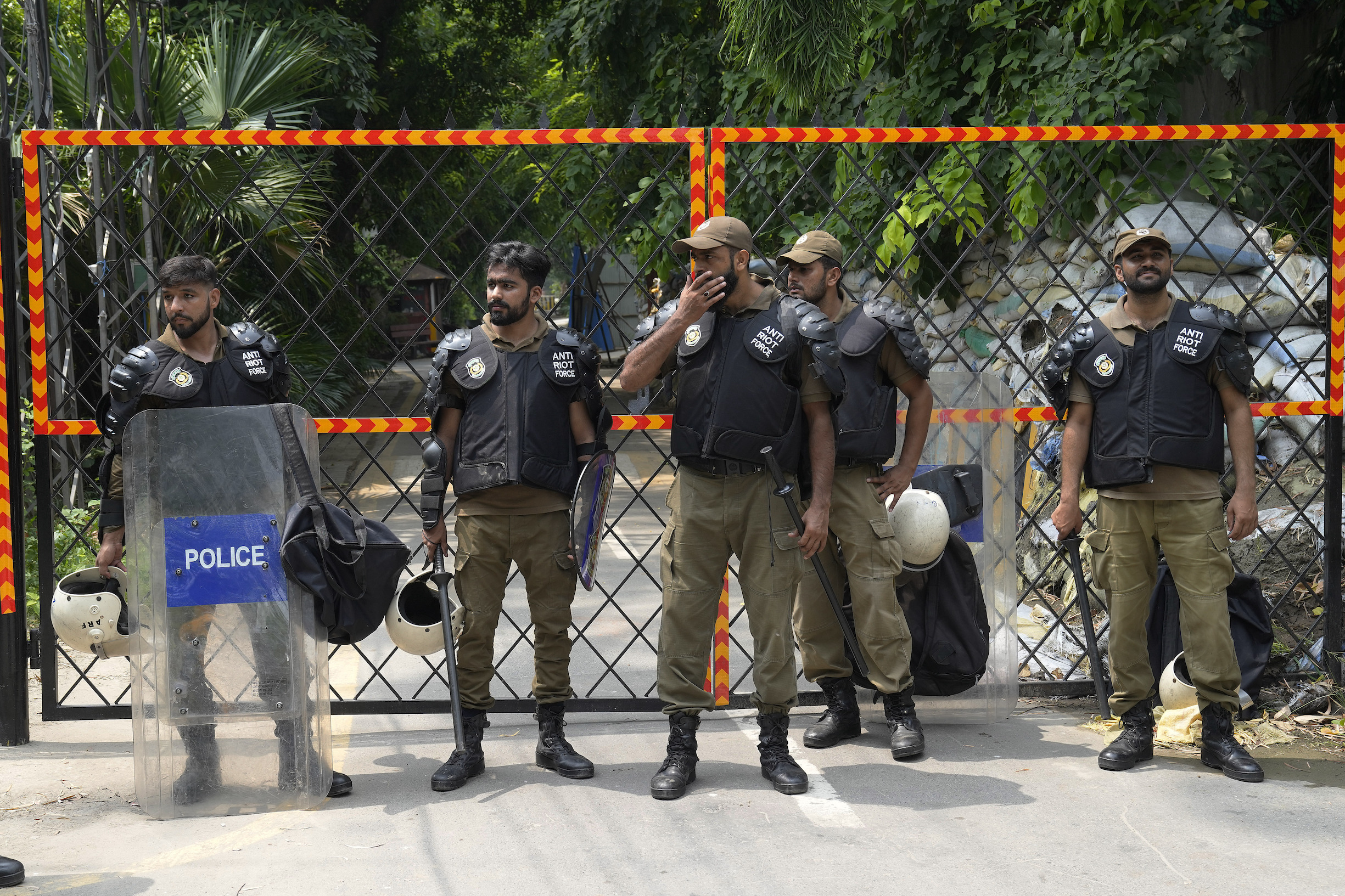 Police officers stand guard outside the residence of Pakistan's former Prime Minister