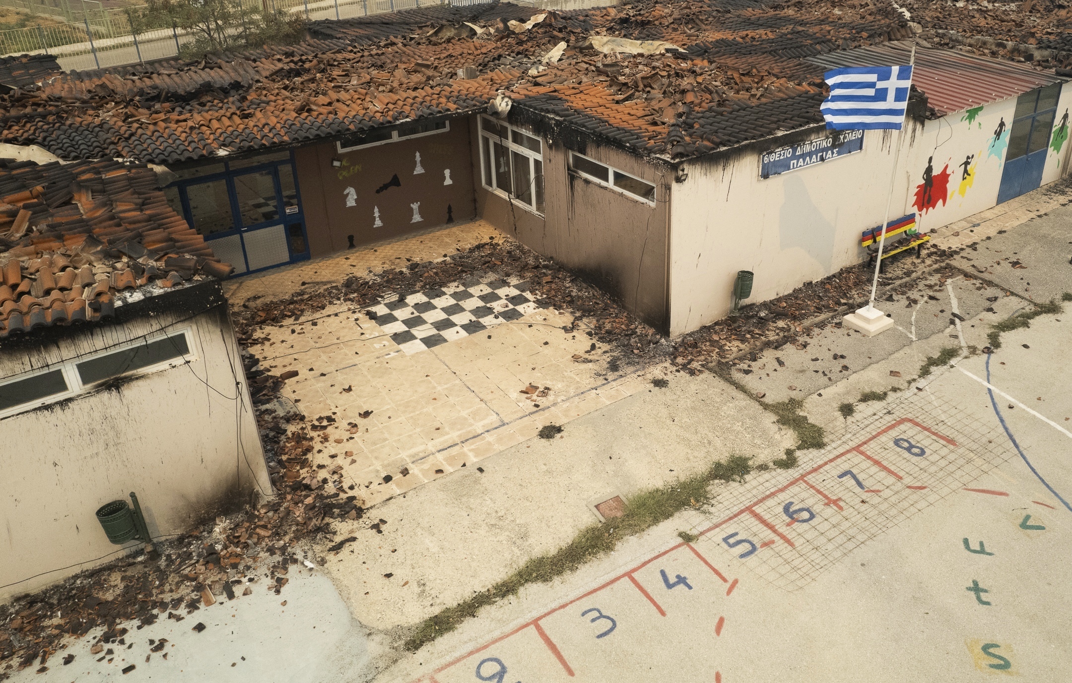 The burnt roof of an elementary school is seen in the village of Palagia, near the town of Alexandroupolis, in the northeastern Evros region