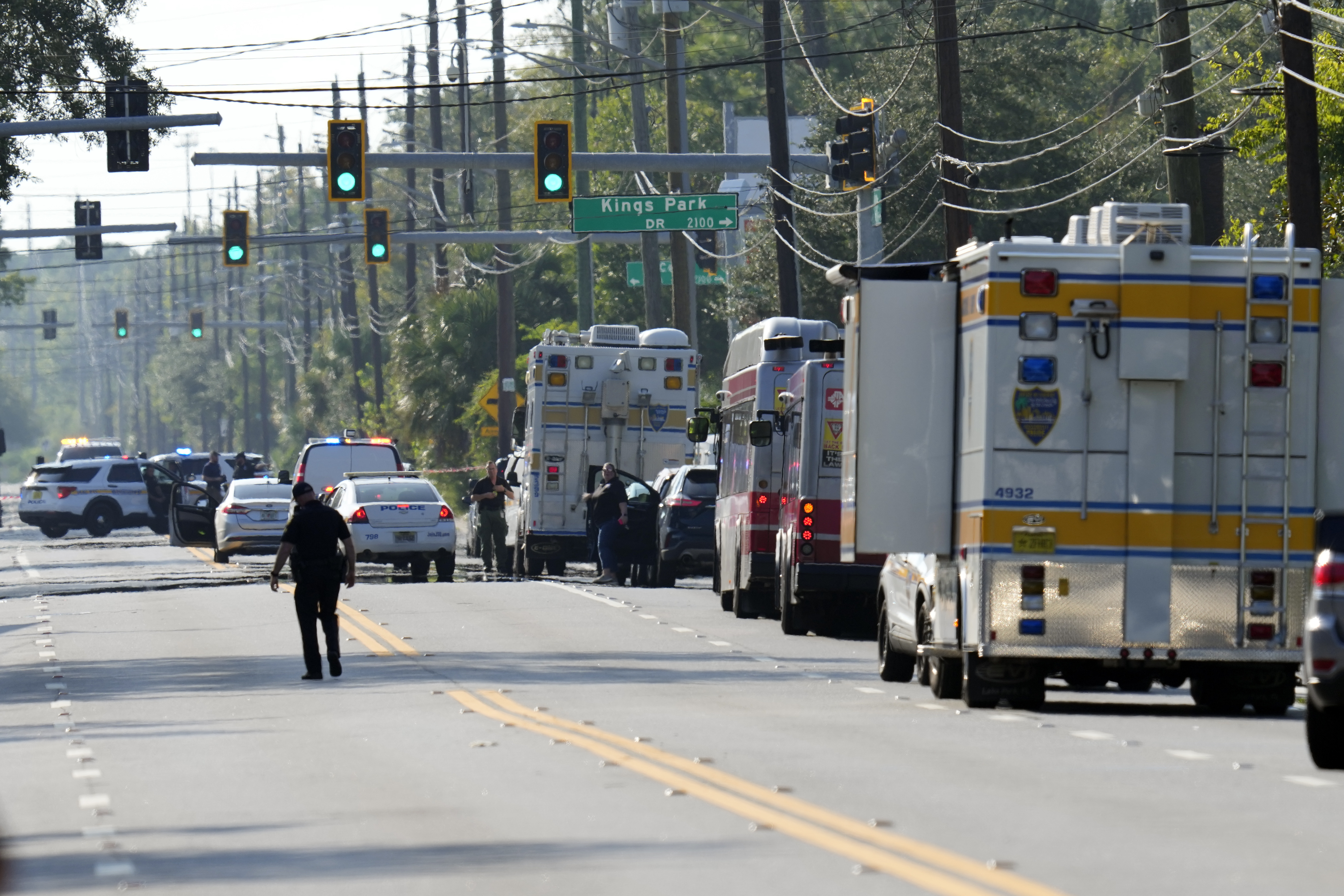 Rows of emergency vehicles and ambulances along the road near the Florida shooting