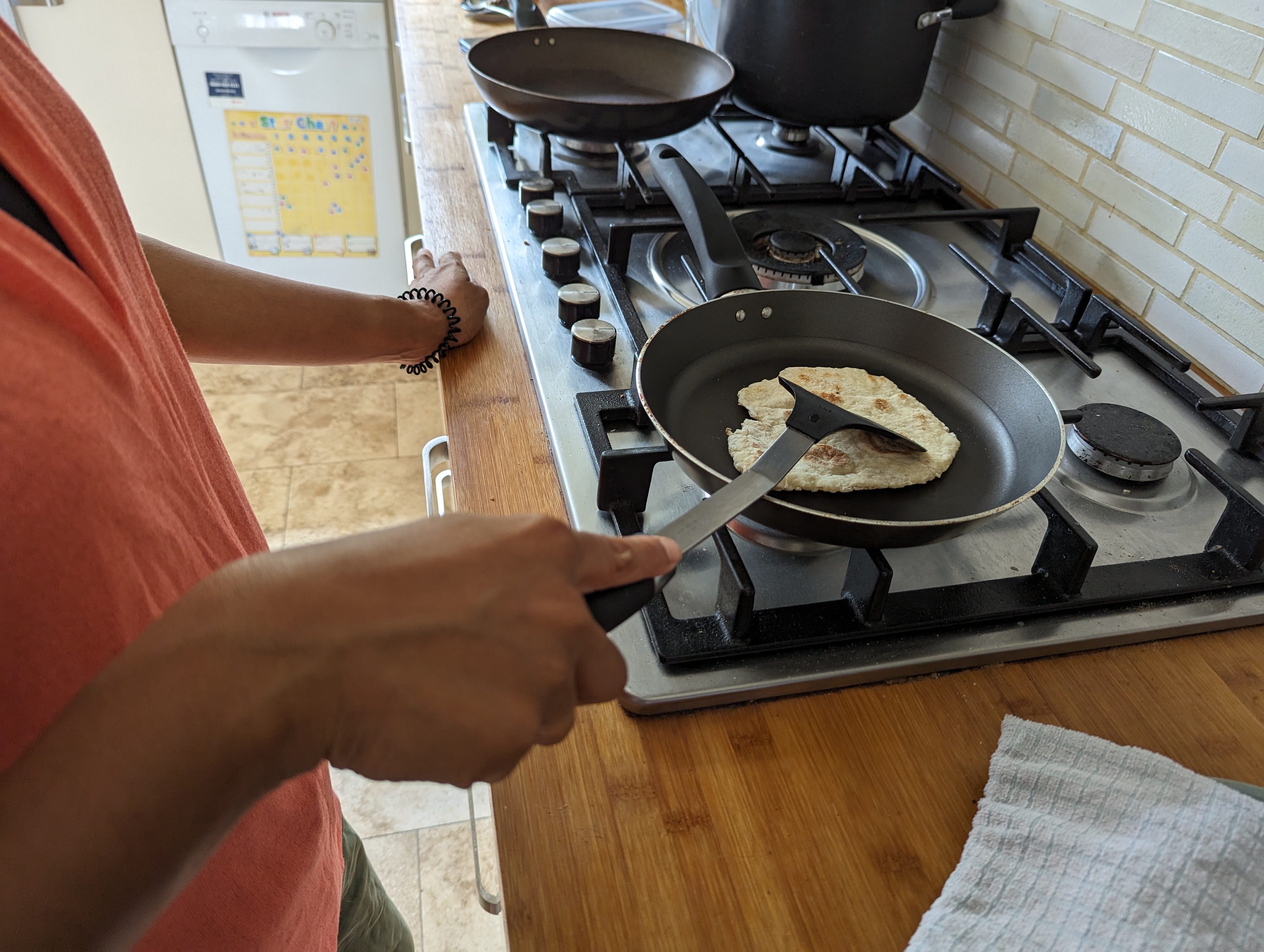 A photo of someone cooking something using a frying pan.