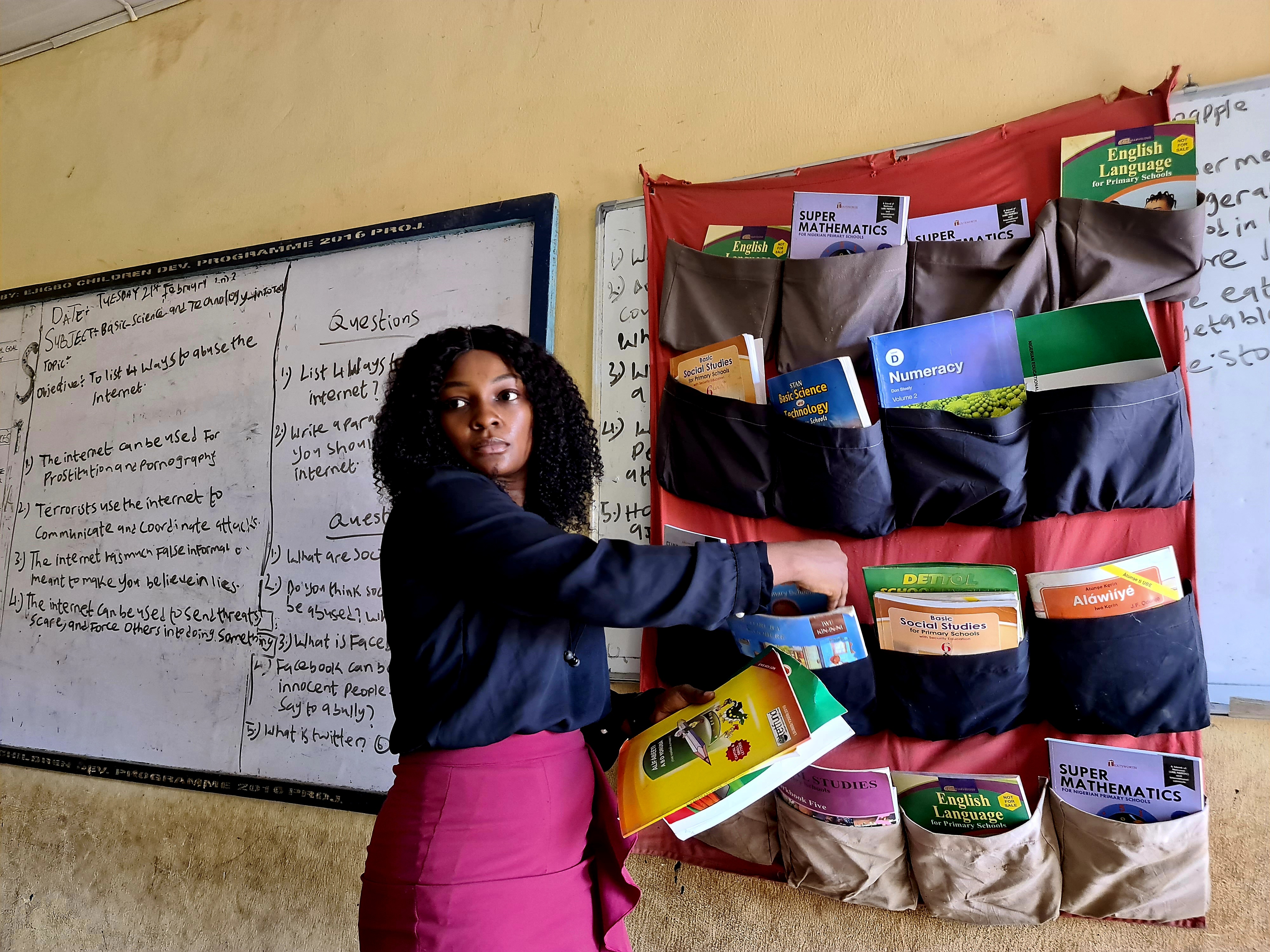 One of the coordinators of The Hanging Library visits a school in Lagos after the installation of a library