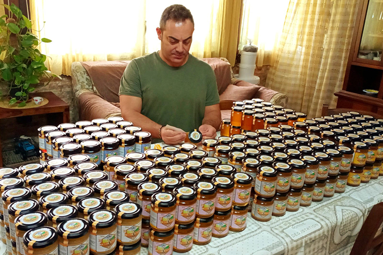 Claudio’s honey jars stashed at home before wildfires destroyed a year's worth of production [Photo courtesy of Claudio Meli]