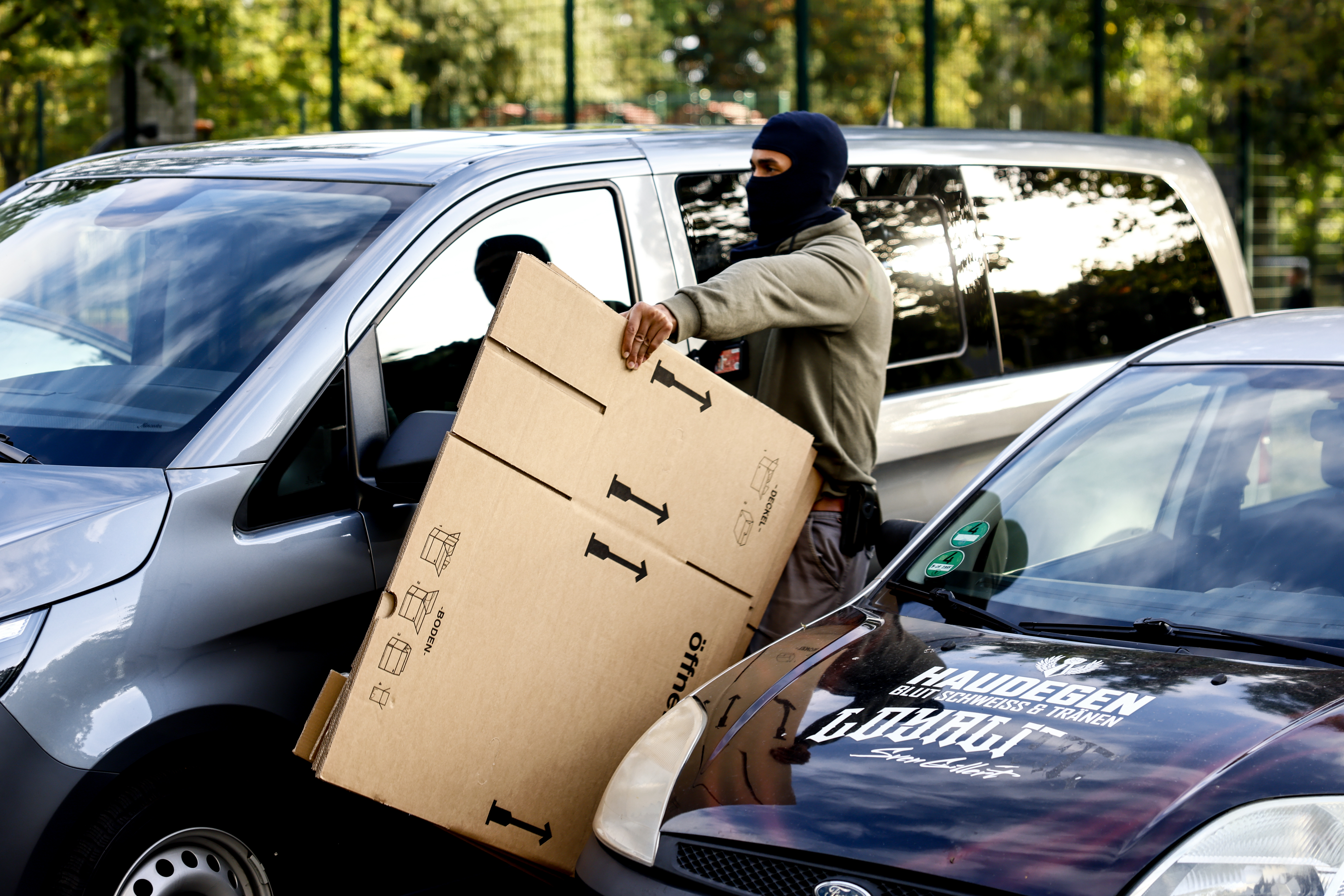 A police officer during a raid in the east part of Berlin, Germany