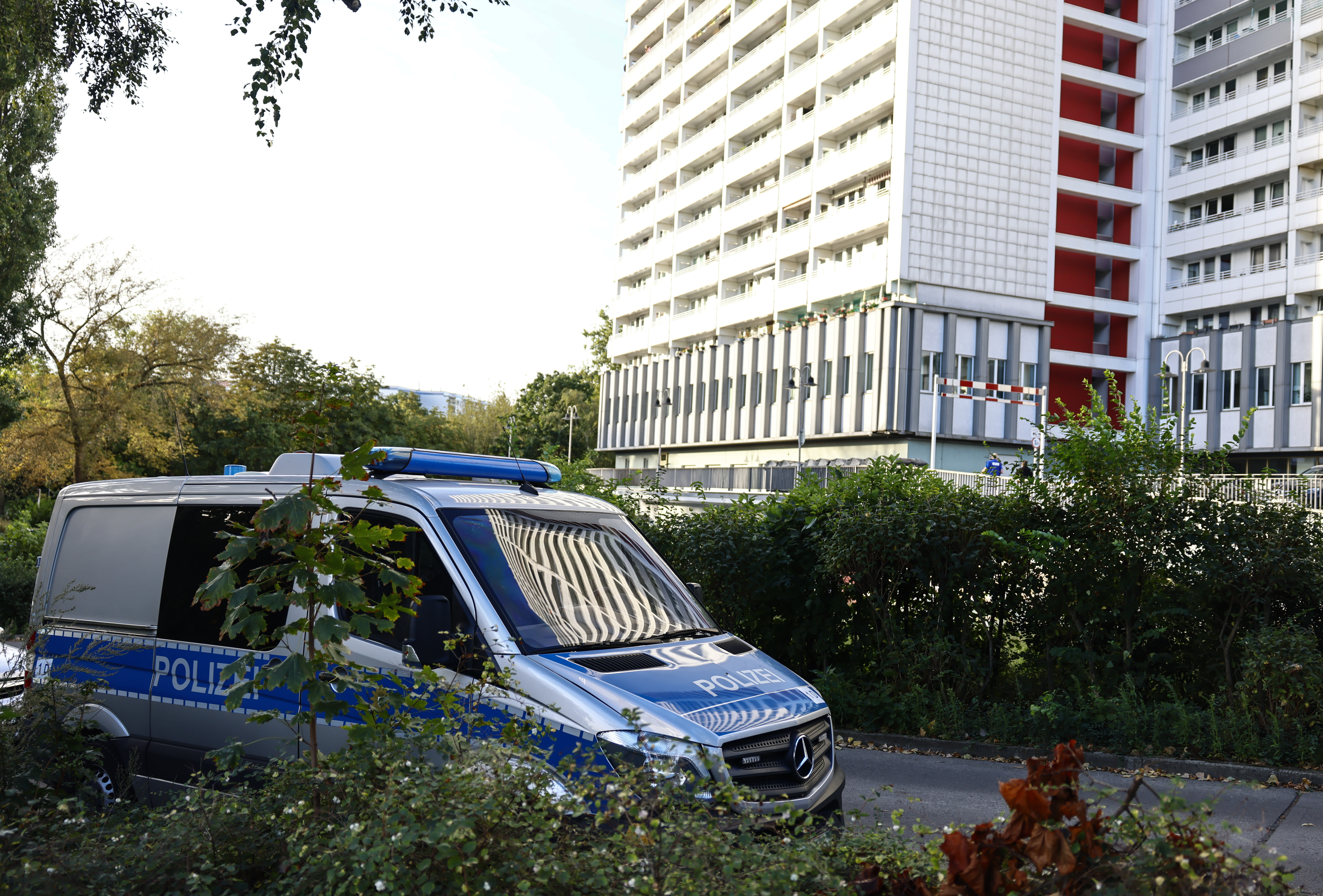 A police officer during a raid in the east part of Berlin, Germany