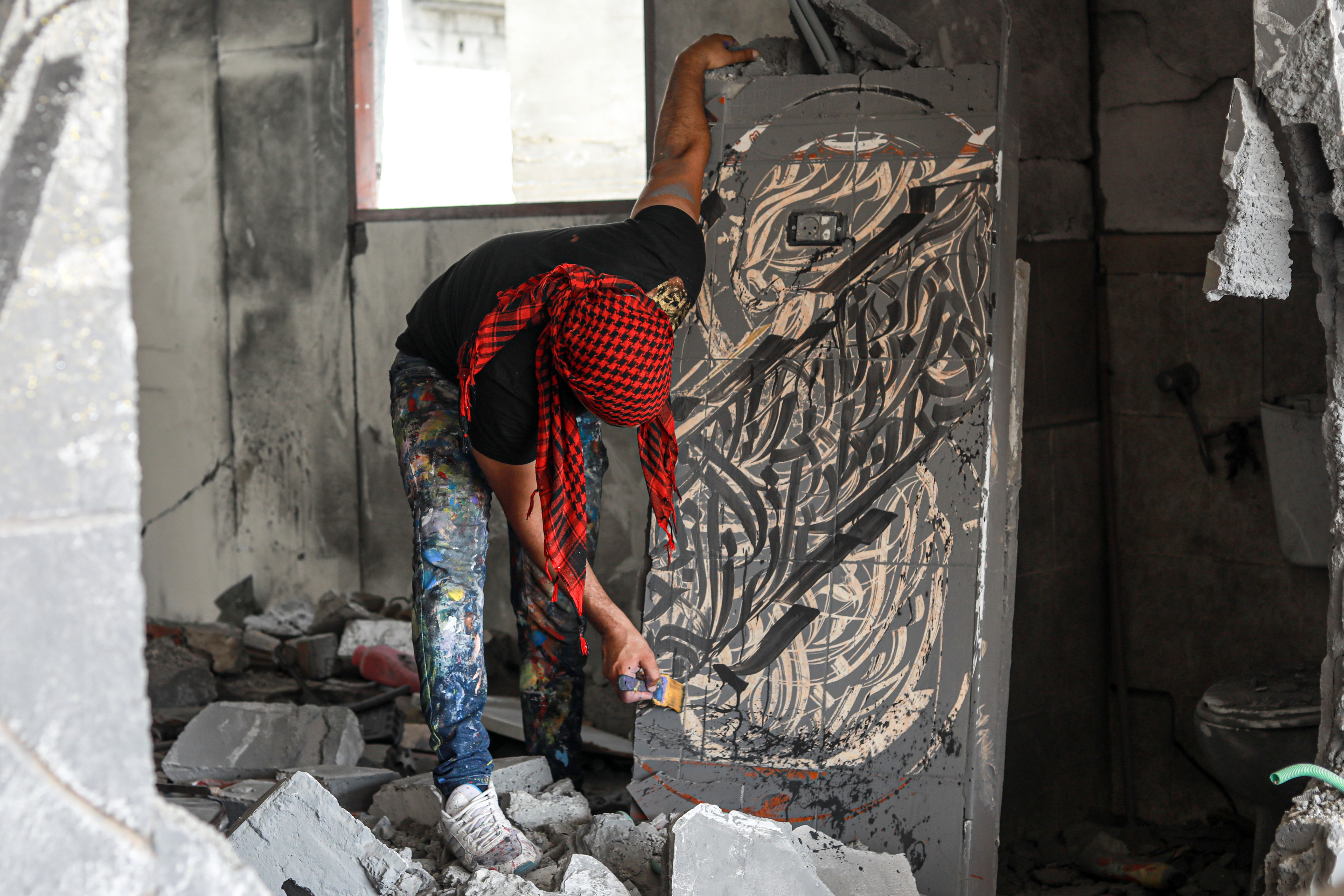 He paints the lower half of a wall