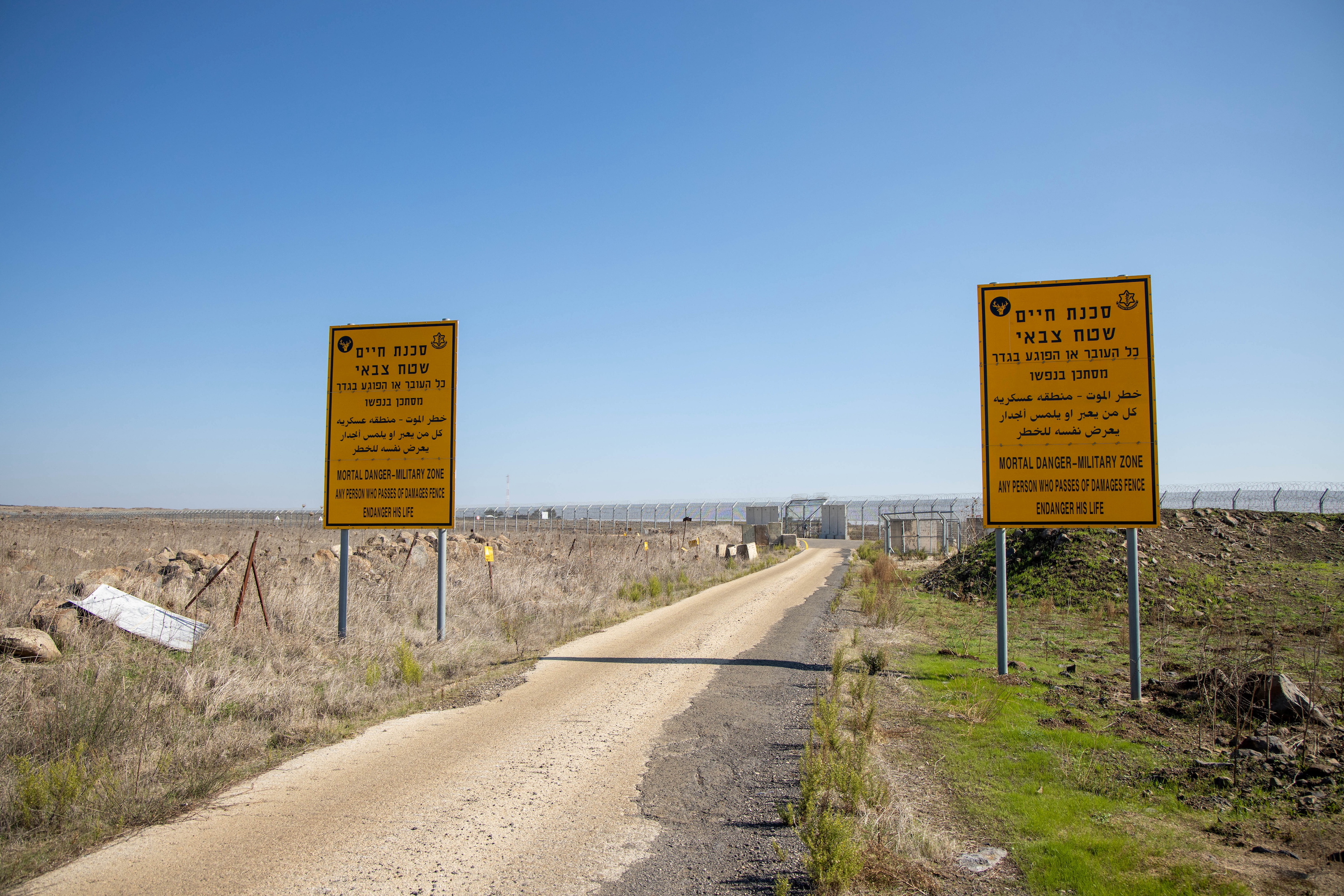 Warning signs are seen near the border area between Israel and Syria, in the Israeli-occupied Golan Heights November 18, 2020.