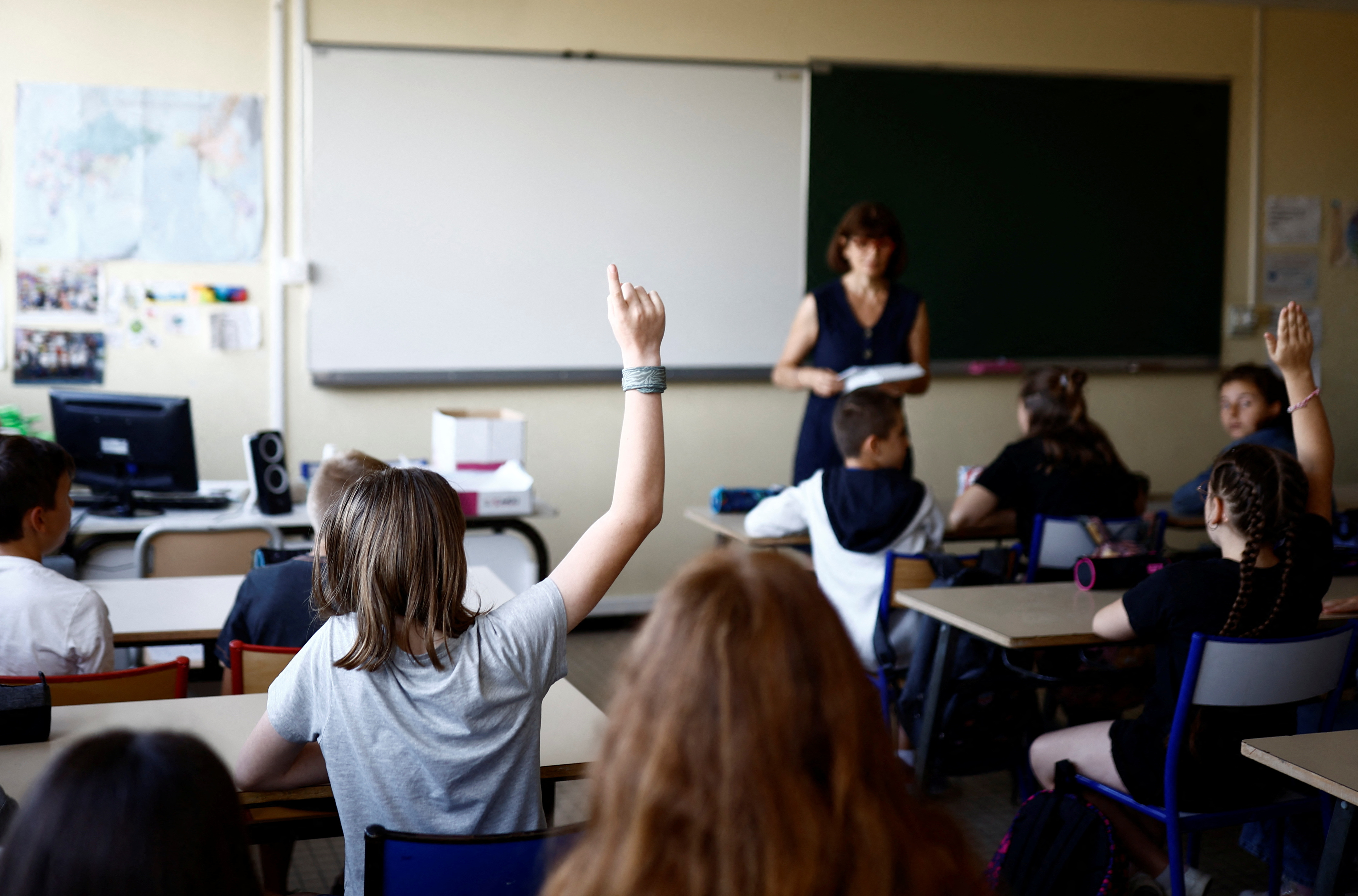 Schoolchildren work in a classroom on the first day of the new school year after summer break at the College Antoine de Saint Exupery Middle School, in Savenay, France