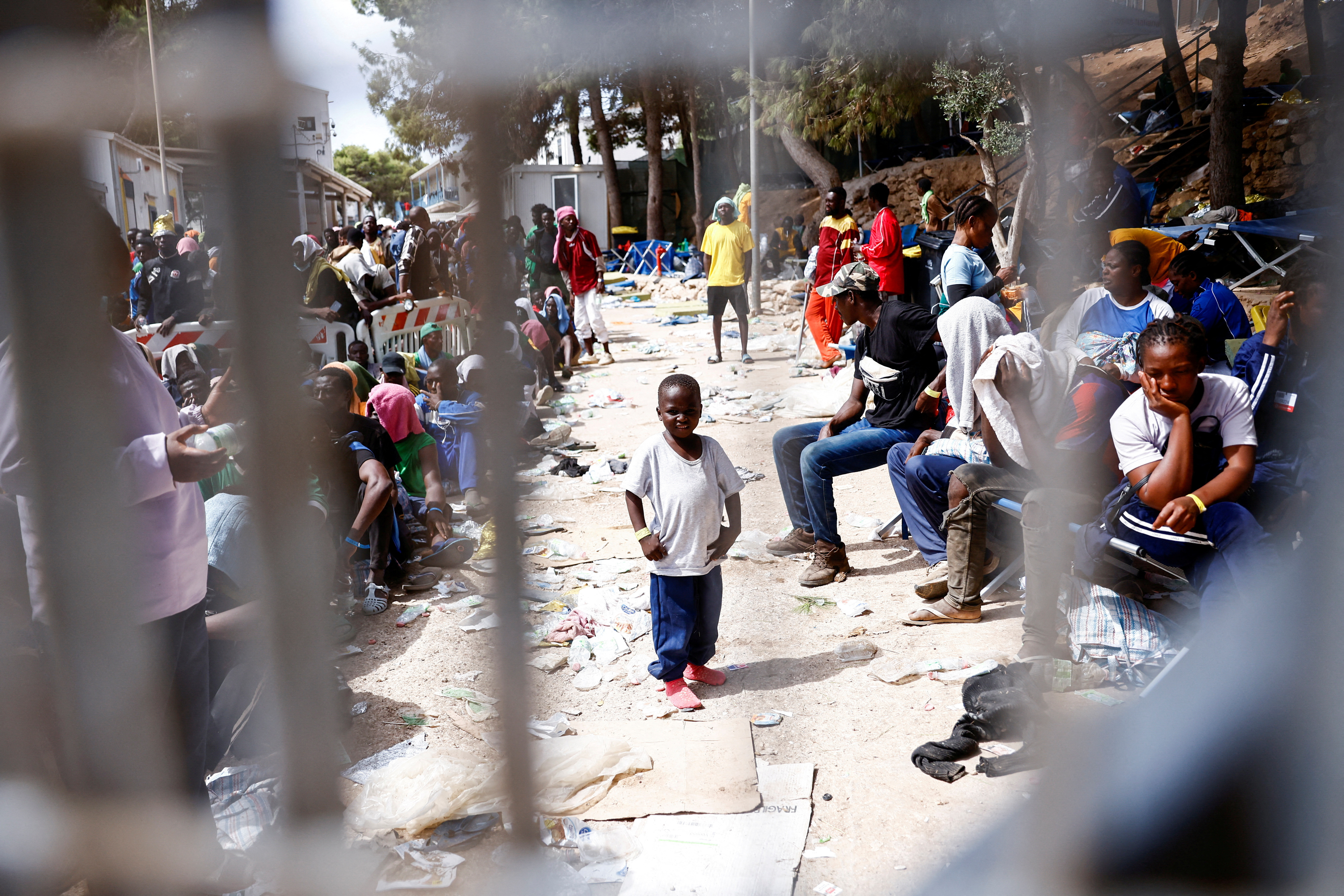 View of a child through a fence