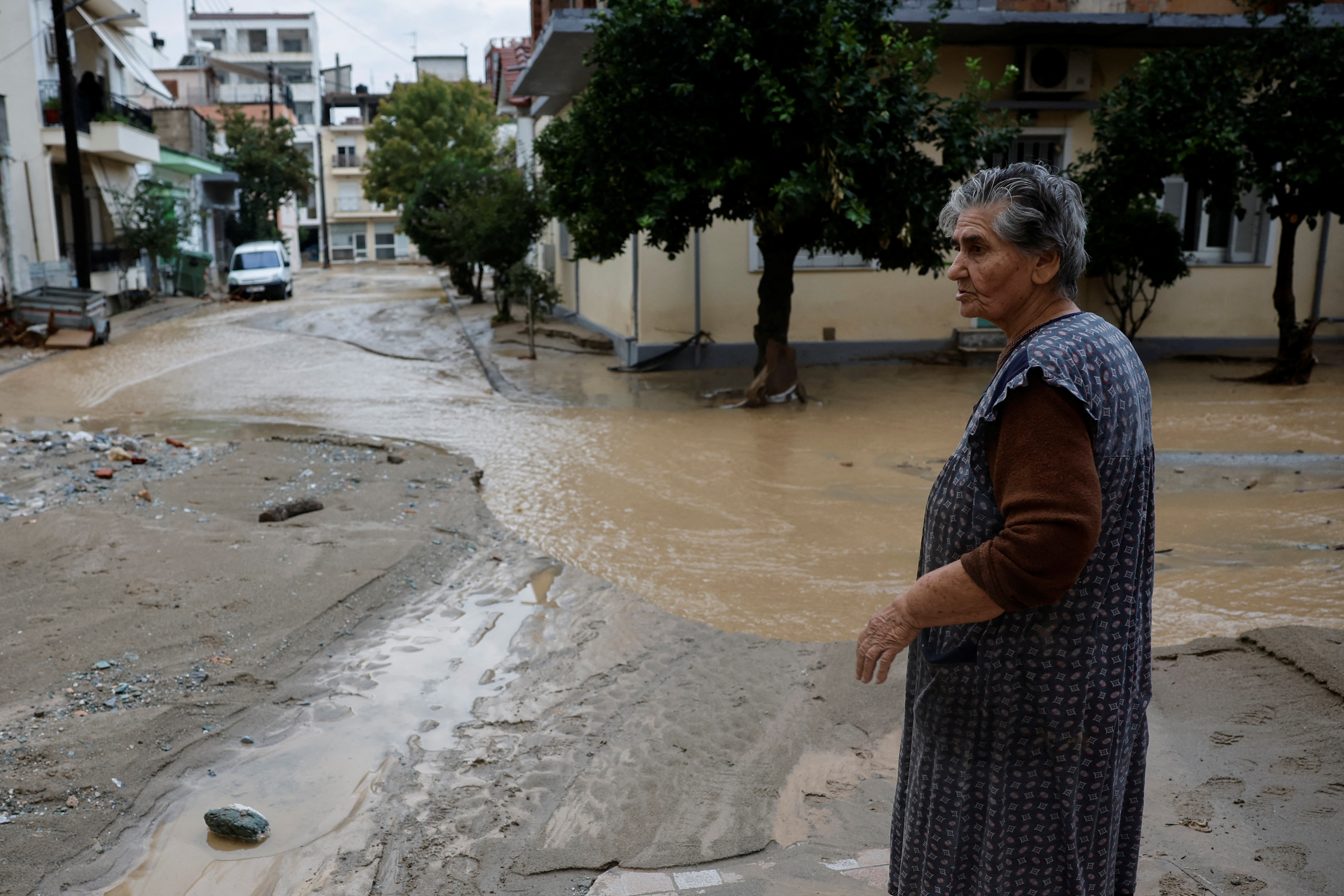 A woman looks at a flooded street as storm Elias hits the city of Volos, Greece