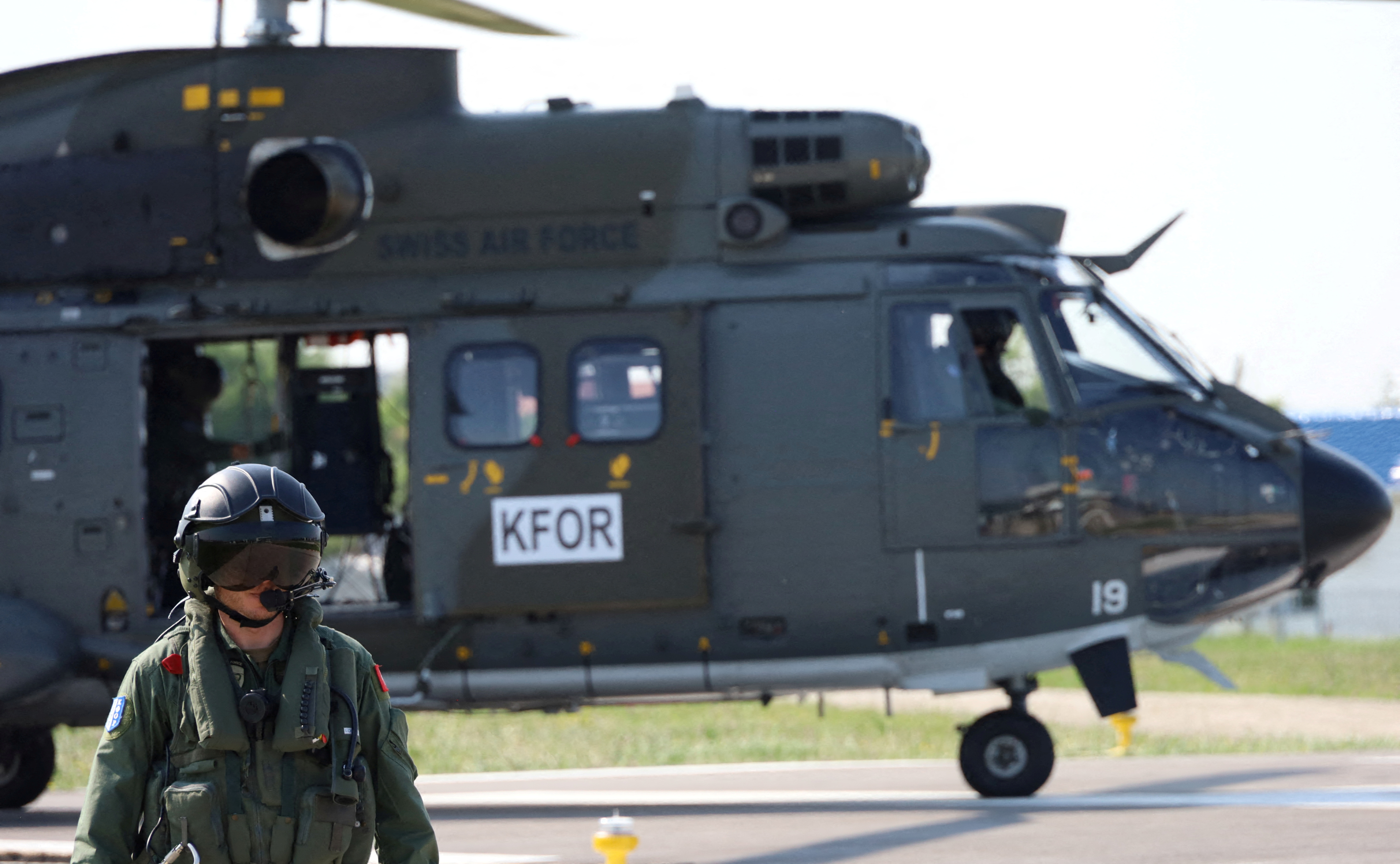 FILE PHOTO: A Swiss pilot member of the NATO-led Kosovo Force (KFOR) walks at NATOÕs headquarters in Pristina, Kosovo, June 20, 2023. REUTERS/Fatos Bytyci/File Photo