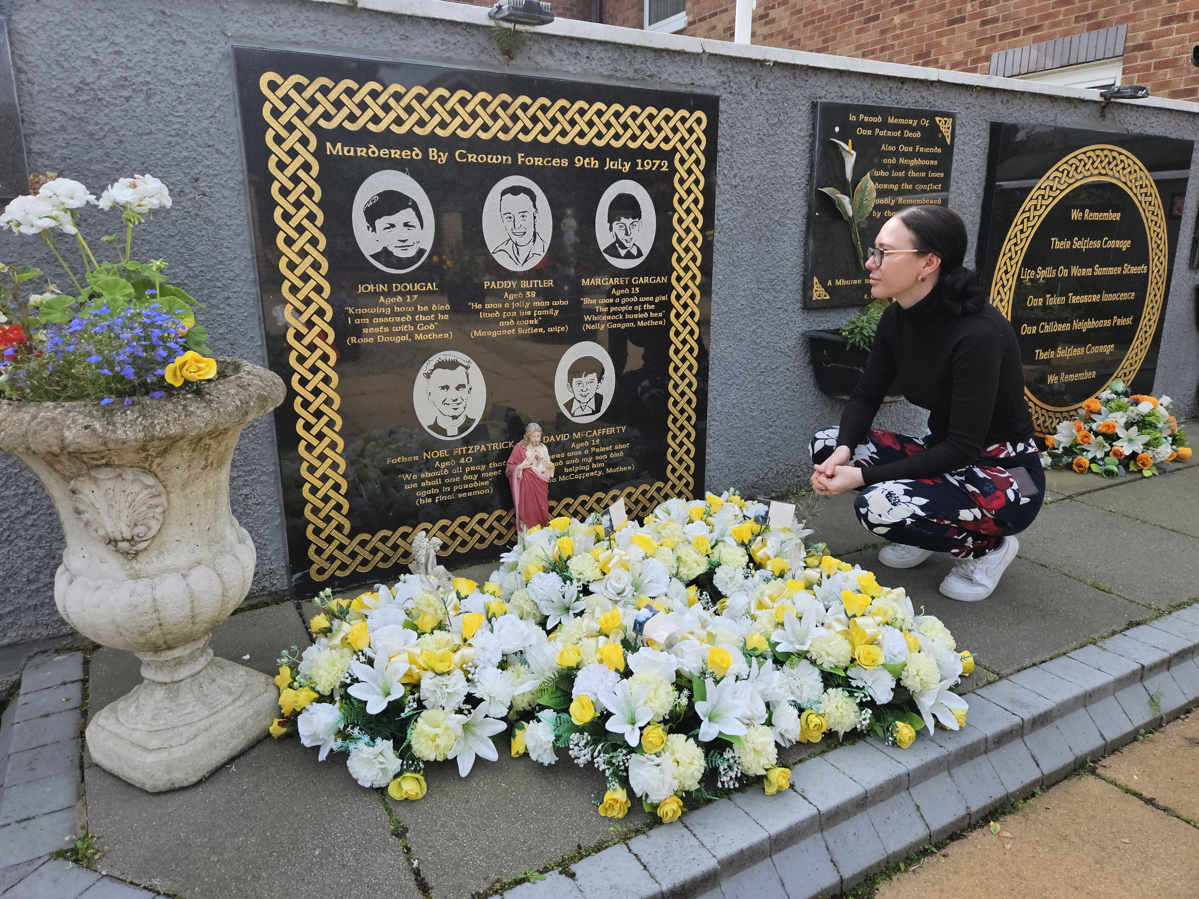 Natasha Butler (relative of Patrick Butler, who was killed in the west Belfast Springhill massacre in 1972) at a small memorial garden created by the community at Westrock (where the attack happened).