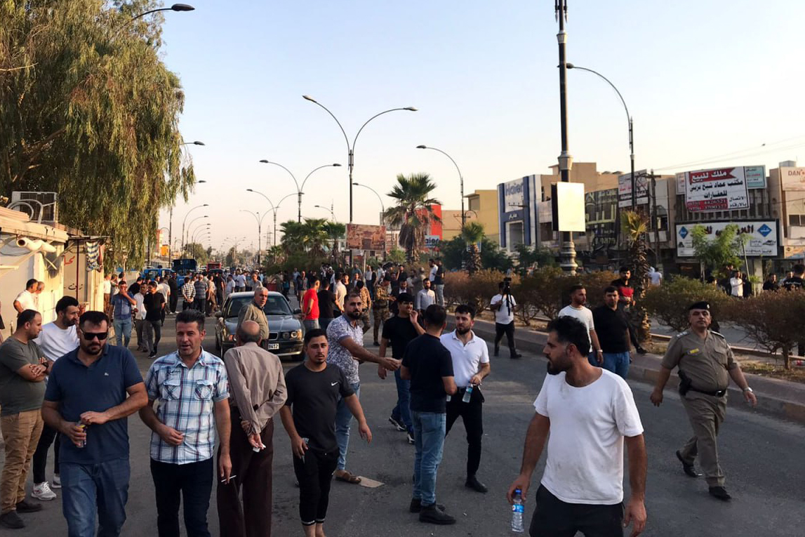 Iraqi protesters block a road following protests in the multi-ethnic Iraqi city of Kirkuk