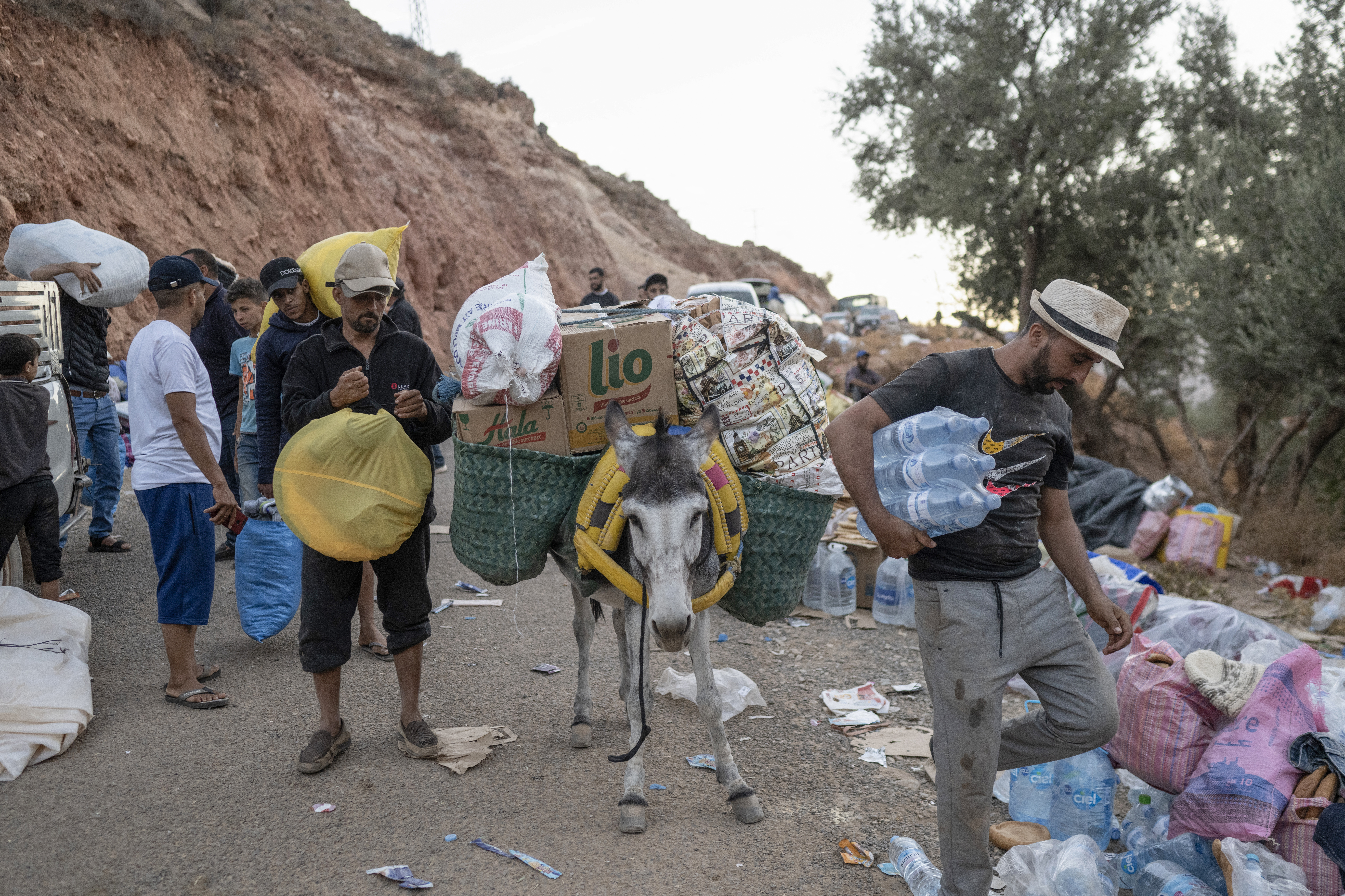 People transport supplies to their village on the back of a donkey as roads are blocked in the mountainous area of Tizi N'Test, in the Taroudant province
