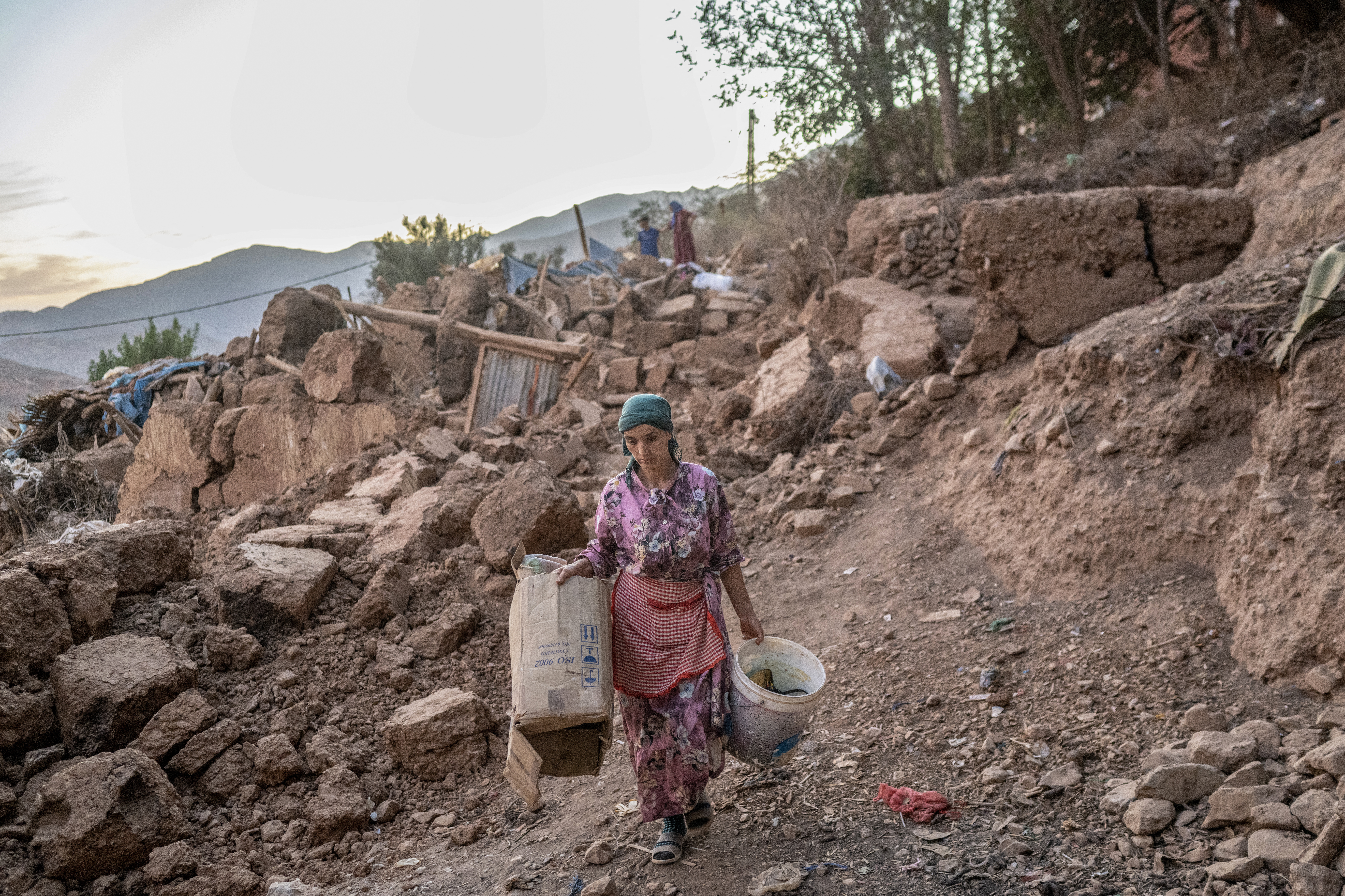 A woman walks in her village in the mountainous area in the mountainous area of Tizi N'Test, in the Taroudant province, one of the most devastated in quake-hit Morocco