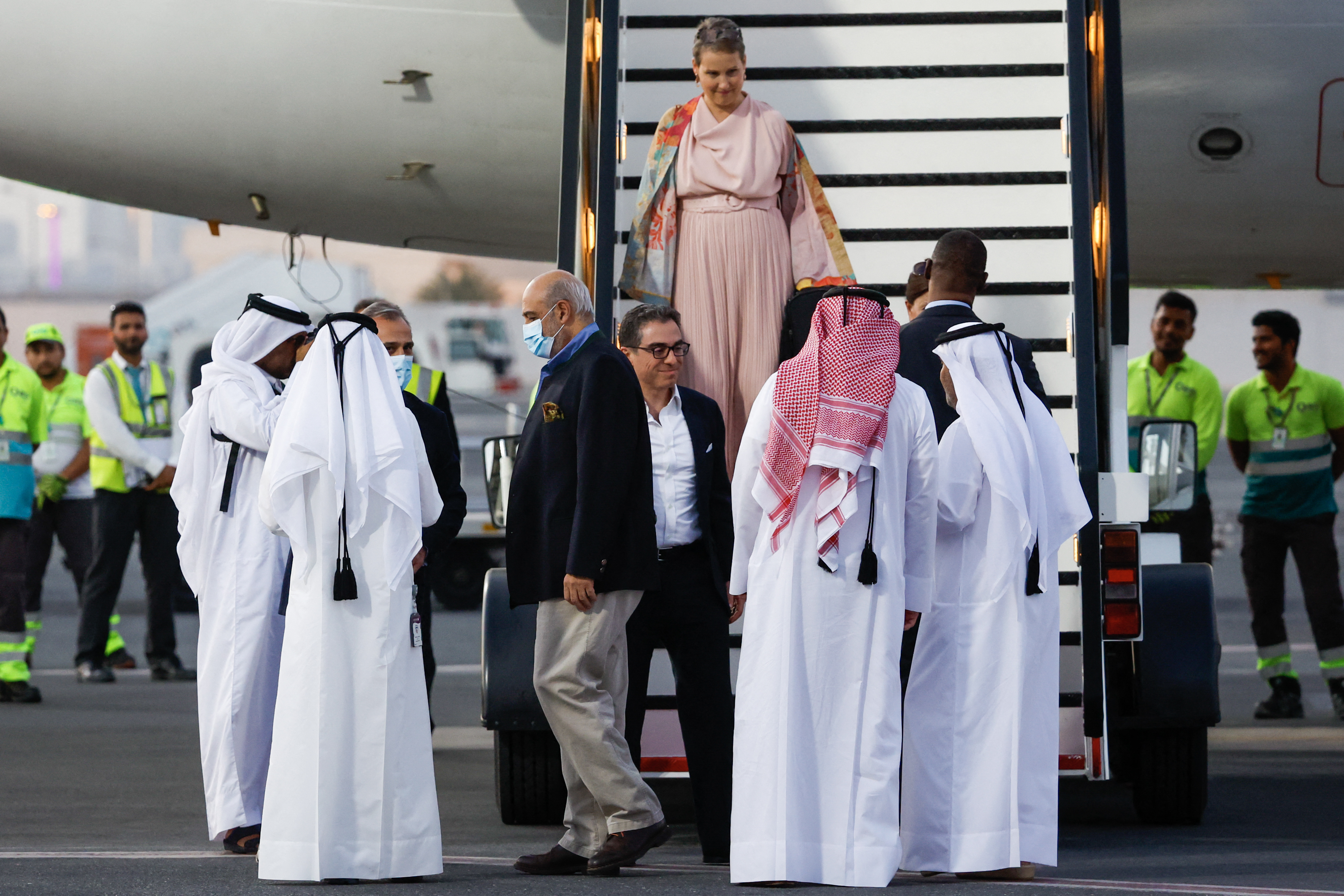 US citizens Siamak Namazi (C with glasses), Emad Sharqi (3rd-L) and Morad Tahbaz (C) are greeted upon their arrival at the Doha International Airport in Doha on September 18, 2023. - Five US detainees, three previously identified as Siamak Namazi, Morad Tahbaz and Emad Sharqi and two who wish to remain anonymous, released by Iran landed in Doha