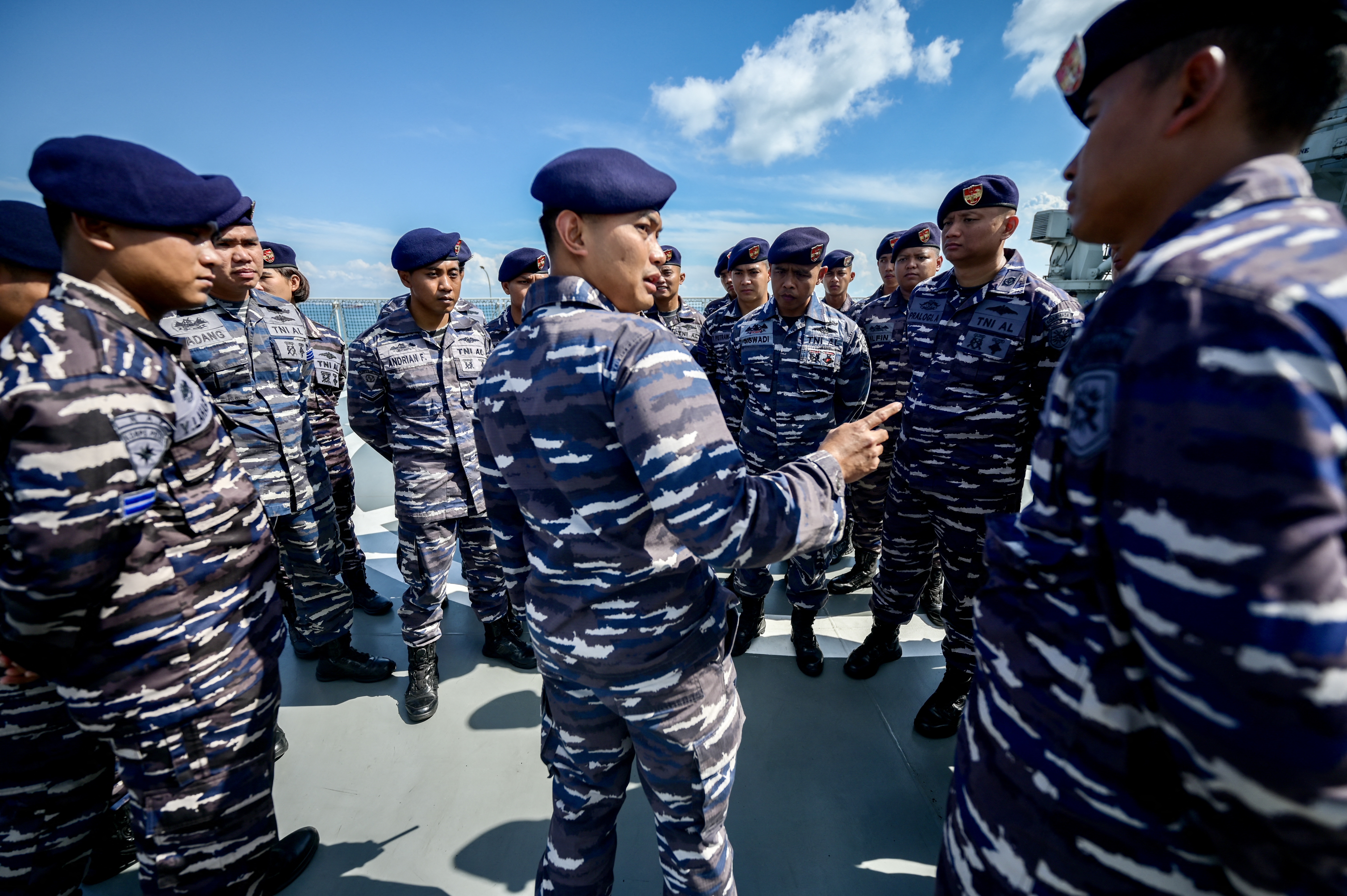 Indonesian sailors during the drills. They're standing in a group