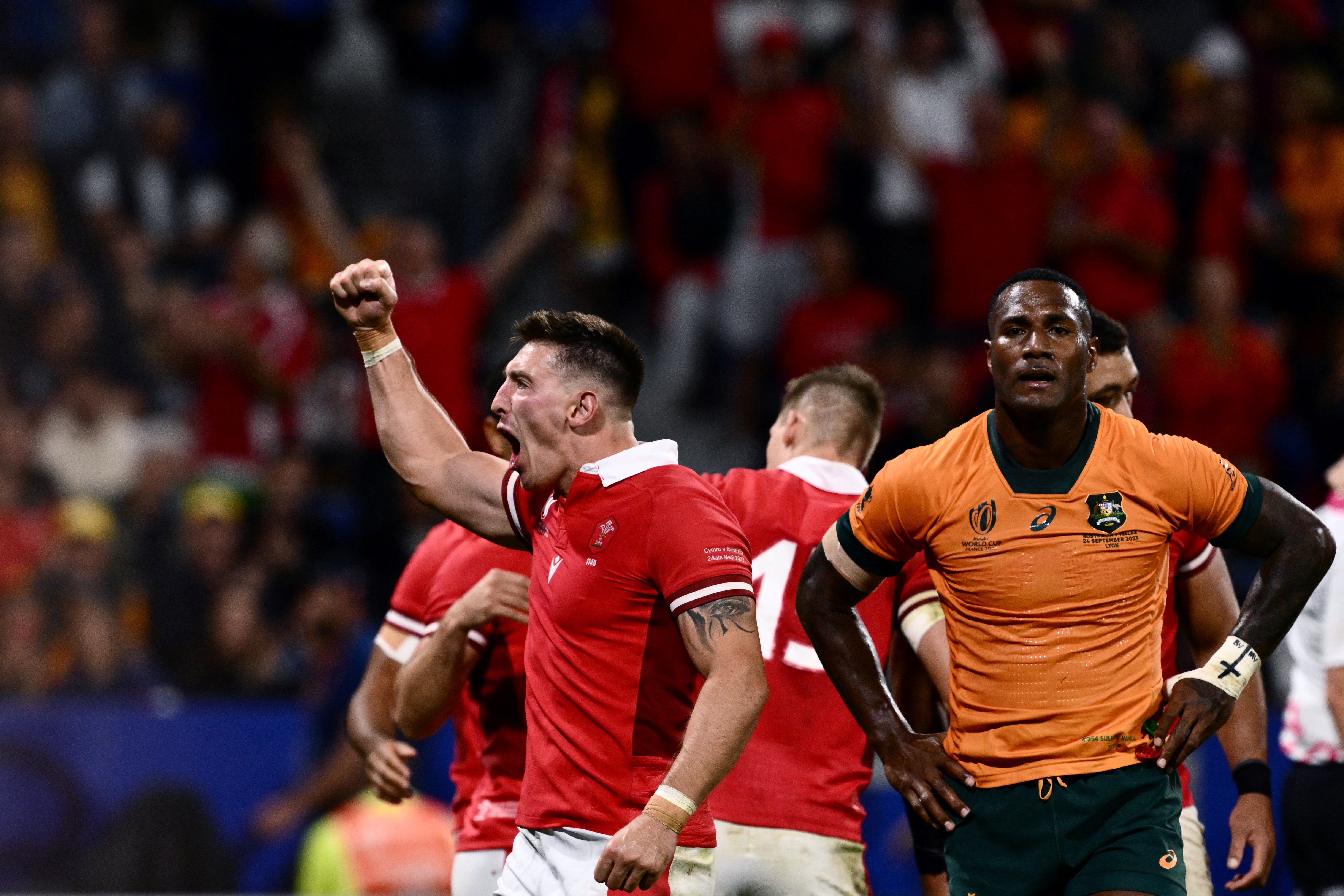 Wales left wing Josh Adams punching the air with delight after Wales' record win over Australia in rugby
