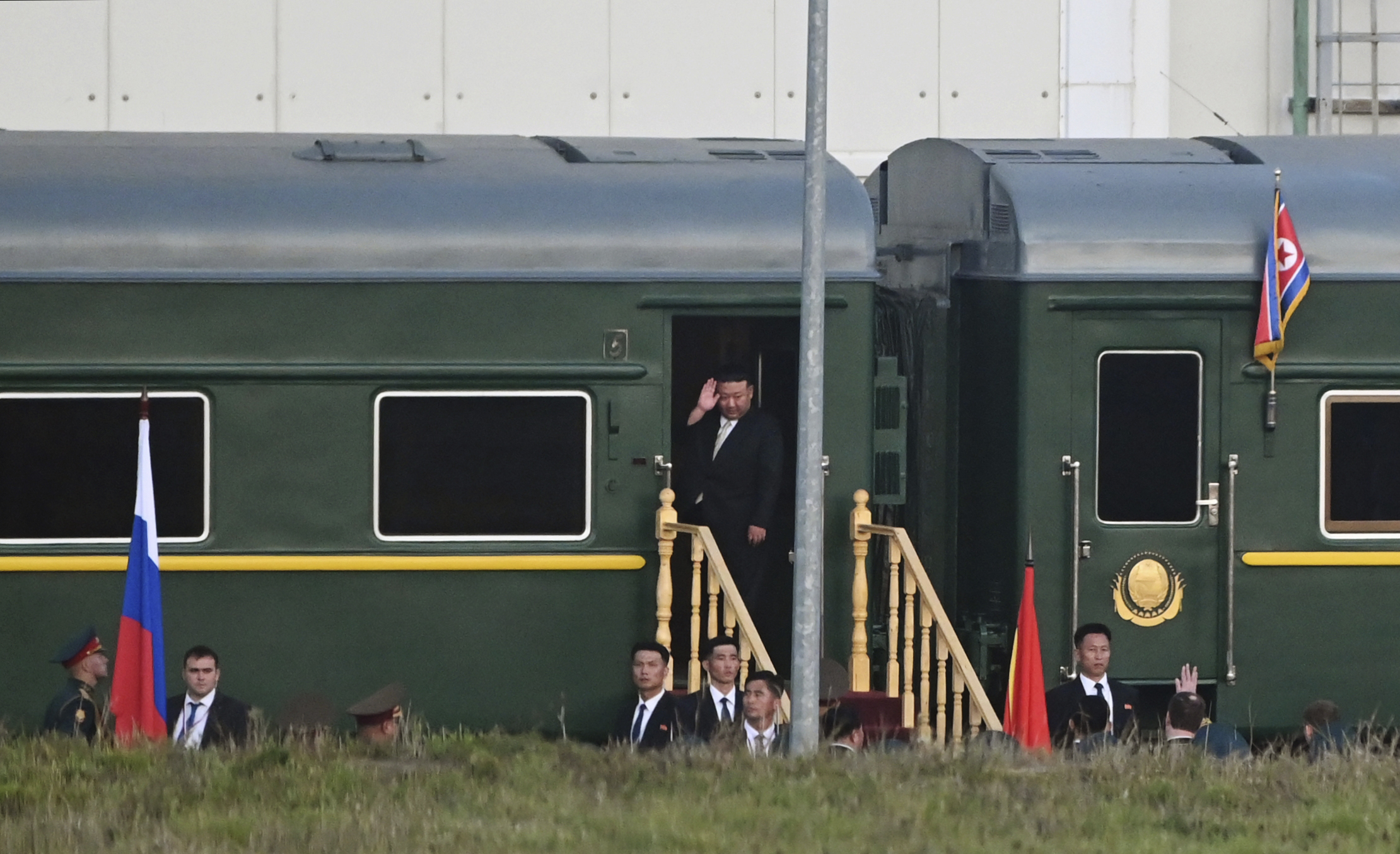 North Korean leader Kim Jong Un waves from a private train as he departs Pyongyang, North Korea, to visit Russia. [KCNA via Reuters]