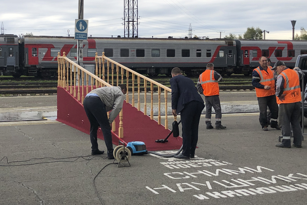 Workers prepare a temporary wooden ramp at the railway station for the arrival of the special train carrying North Korea's leader Kim Jong Un in Komsomolsk-on-Amur, about 6200 kilometers (3,900 miles) east of Moscow, in the Russian Far Eastern Amur region, Thursday, Sept. 14, 2023. (AP Photo)