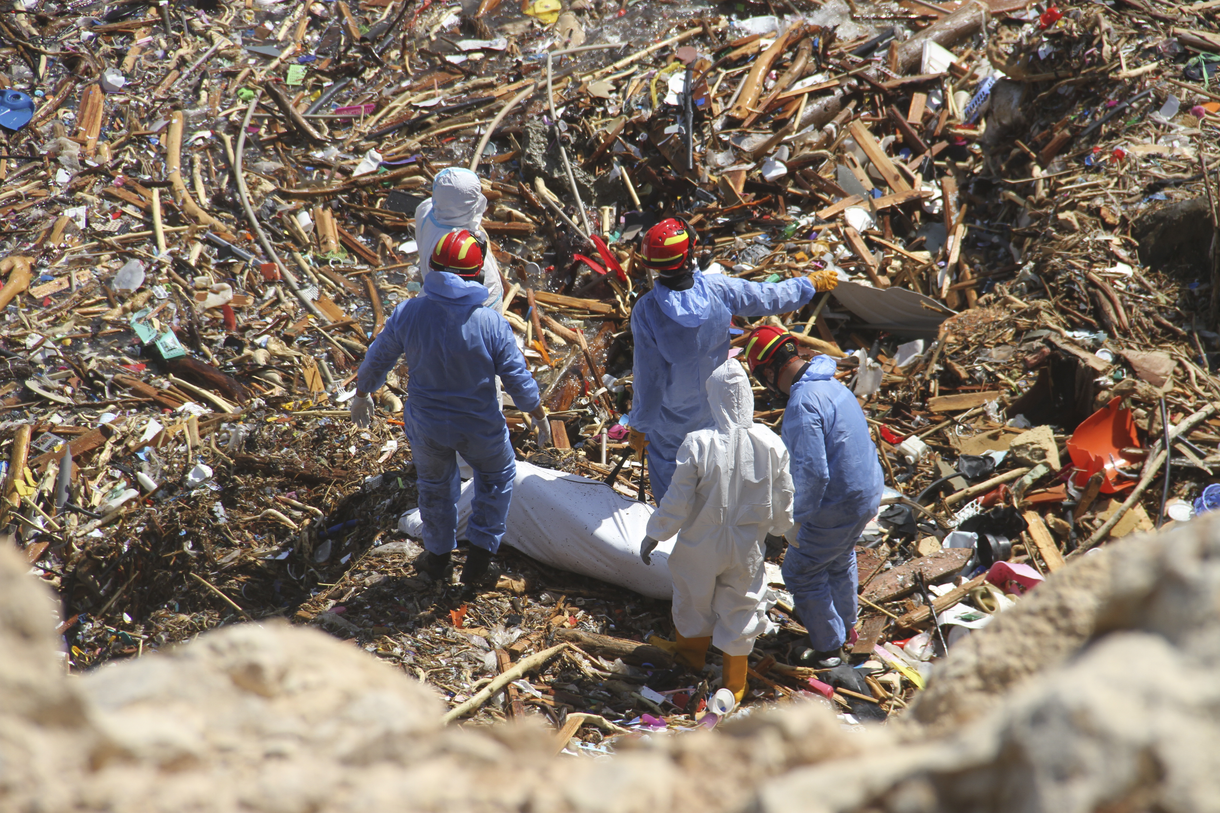 Rescue teams look for flash flood victims in the city of Derna