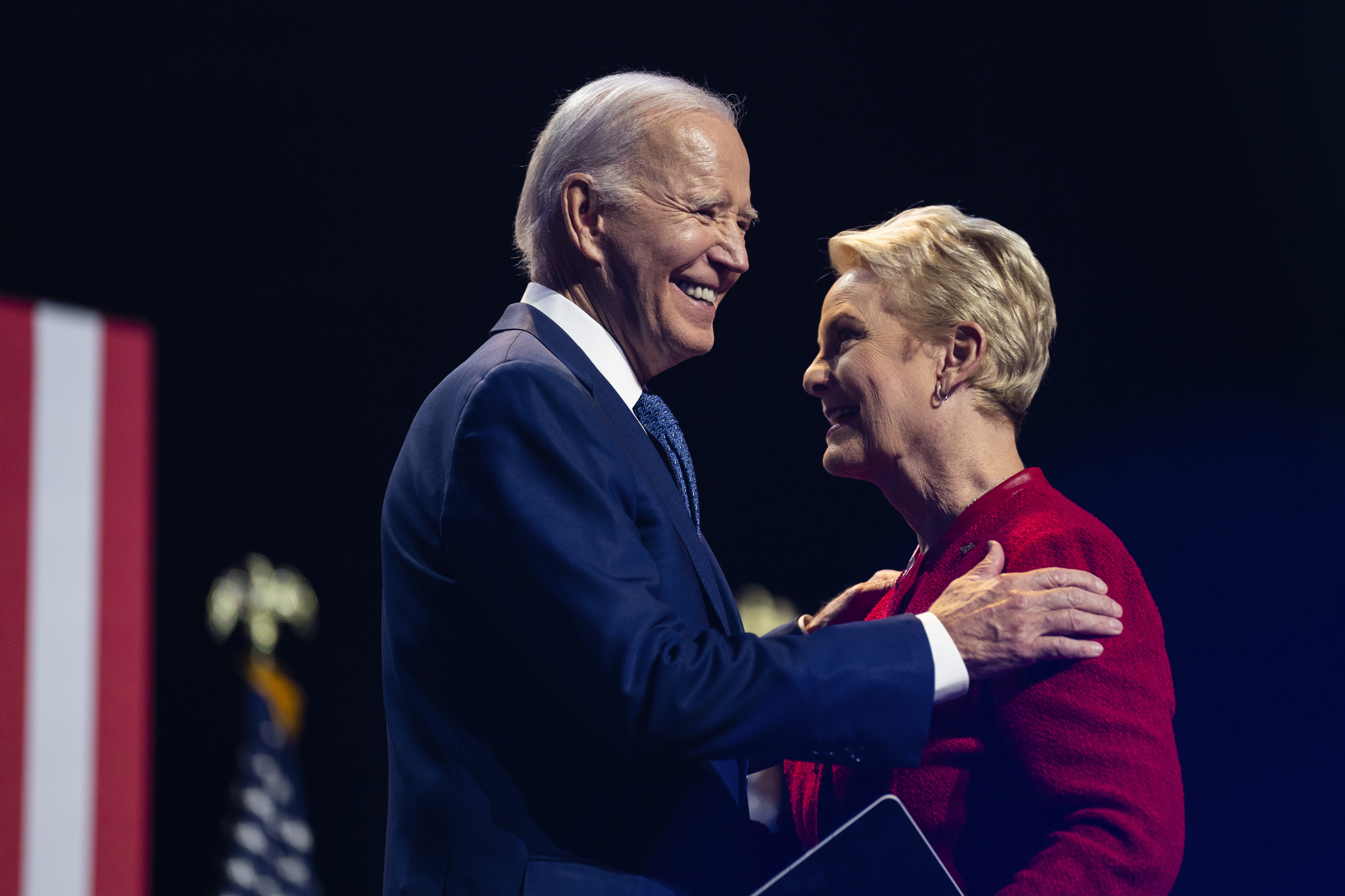 Joe Biden hugs Cindy McCain on stage in Tempe Arizona.