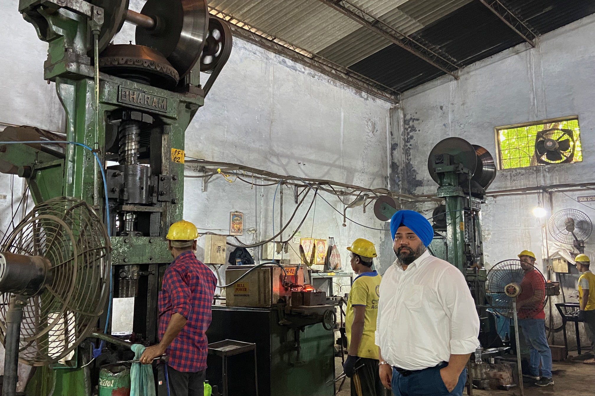 Ashpreet Sahni and his employees at his Ludhiana factory, which makes tractor parts