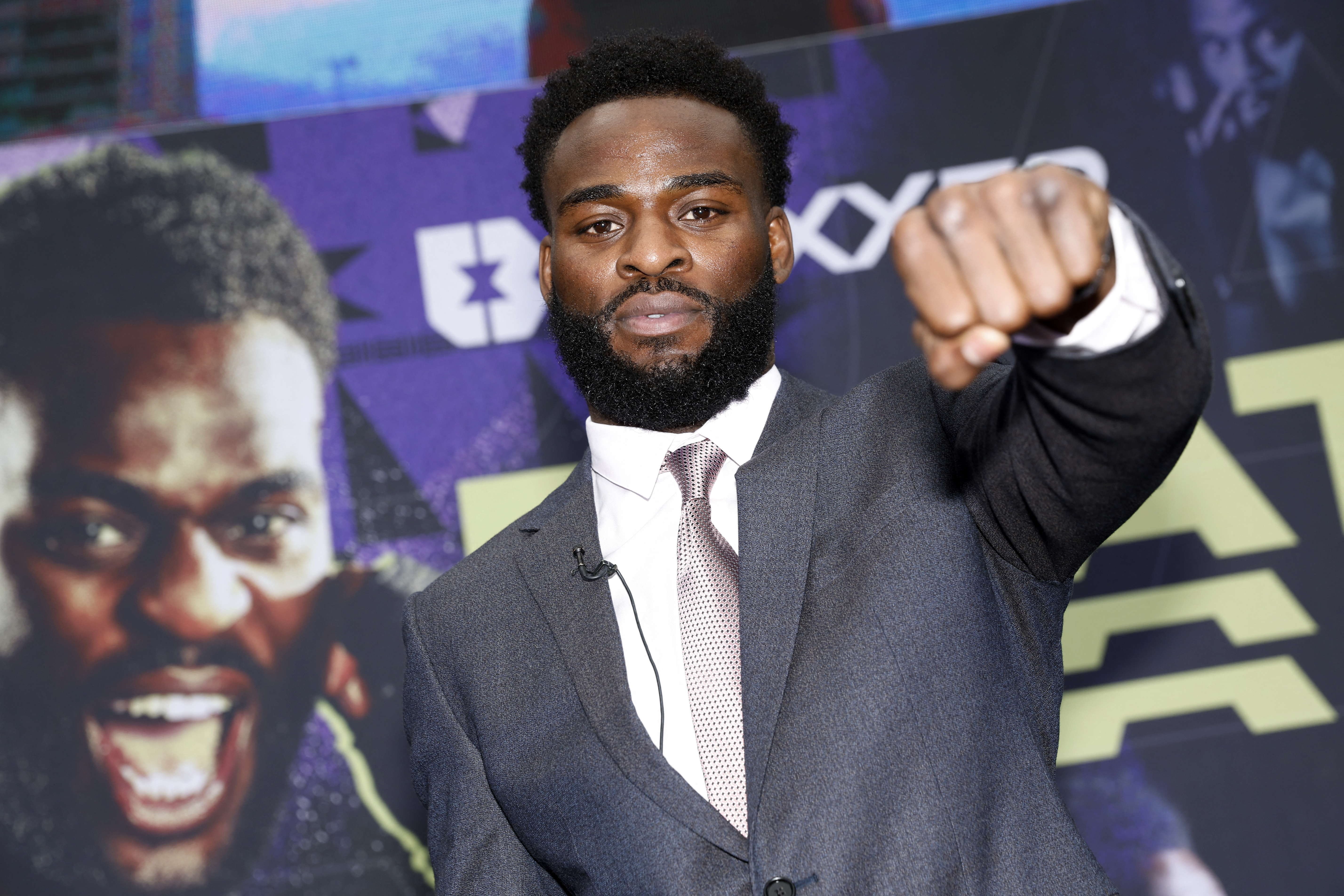 Joshua Buatsi holds out a fist during a press conference