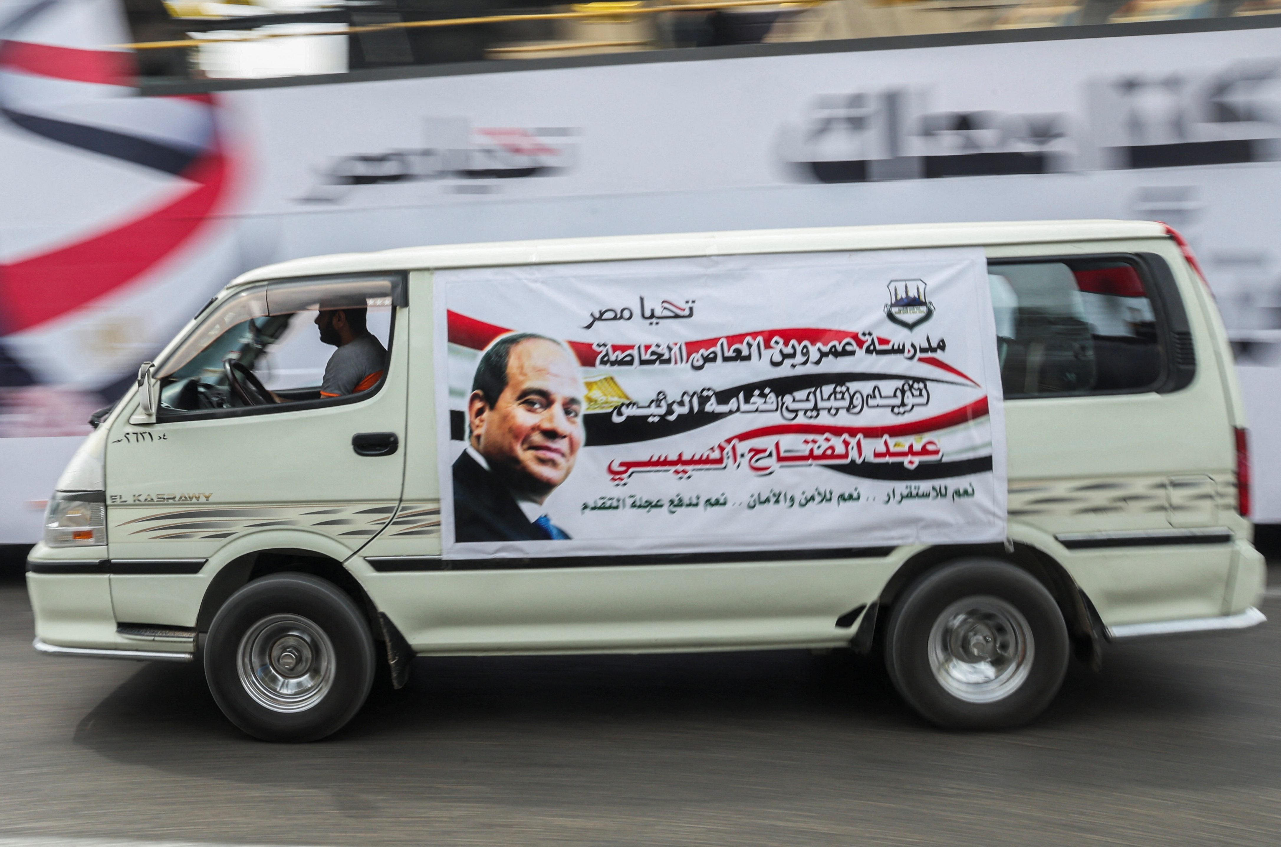 A view shows a vehicle with the banner of Egyptian President Abdel Fattah al-Sisi during a rally to back his candidacy in the presidential elections in December, at Al Galaa Square in the Dokki district of Giza, Egypt, October 2, 2023. REUTERS/Amr Abdallah Dalsh