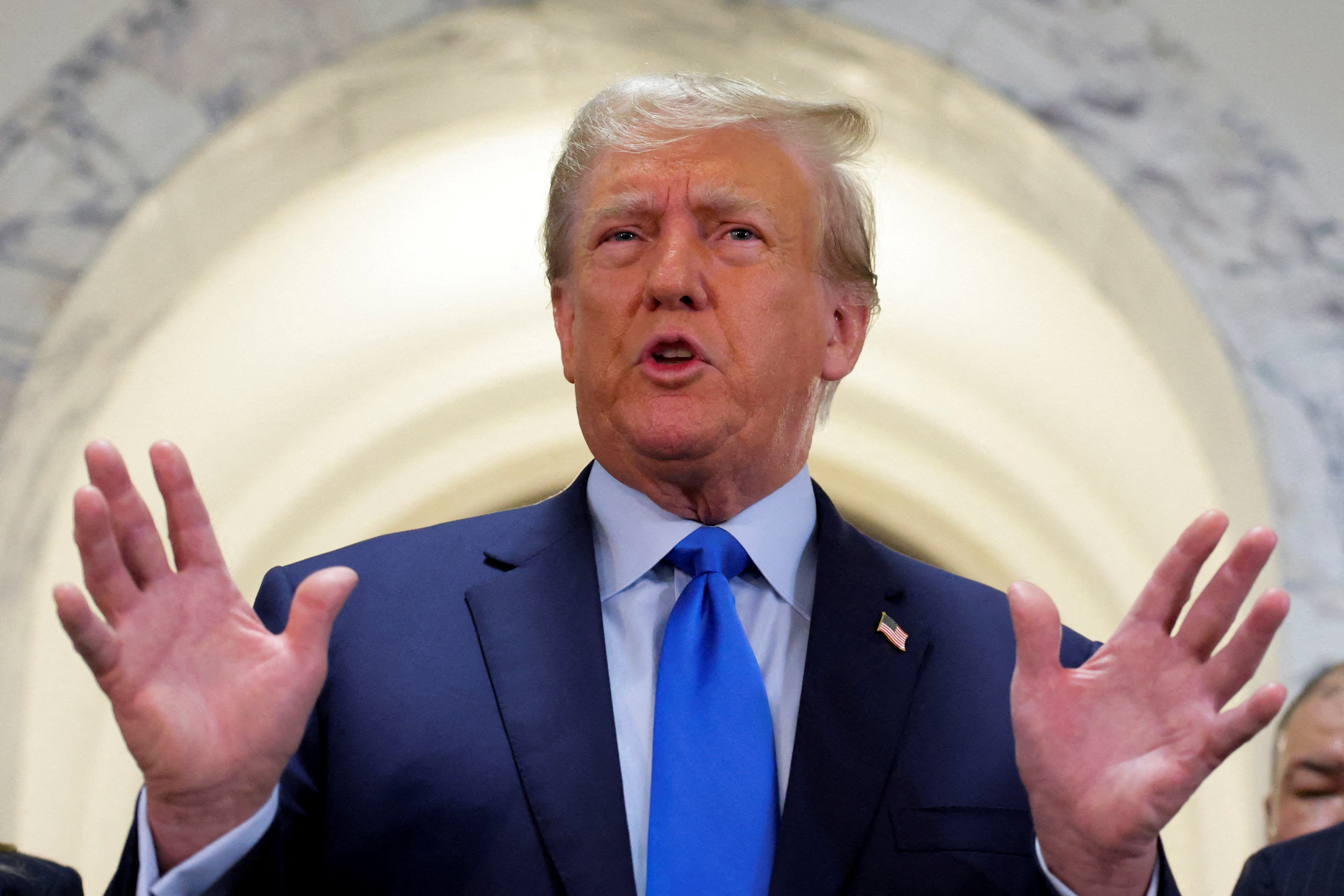 Former U.S. President Donald Trump speaks to the media as he arrives at a Manhattan courthouse