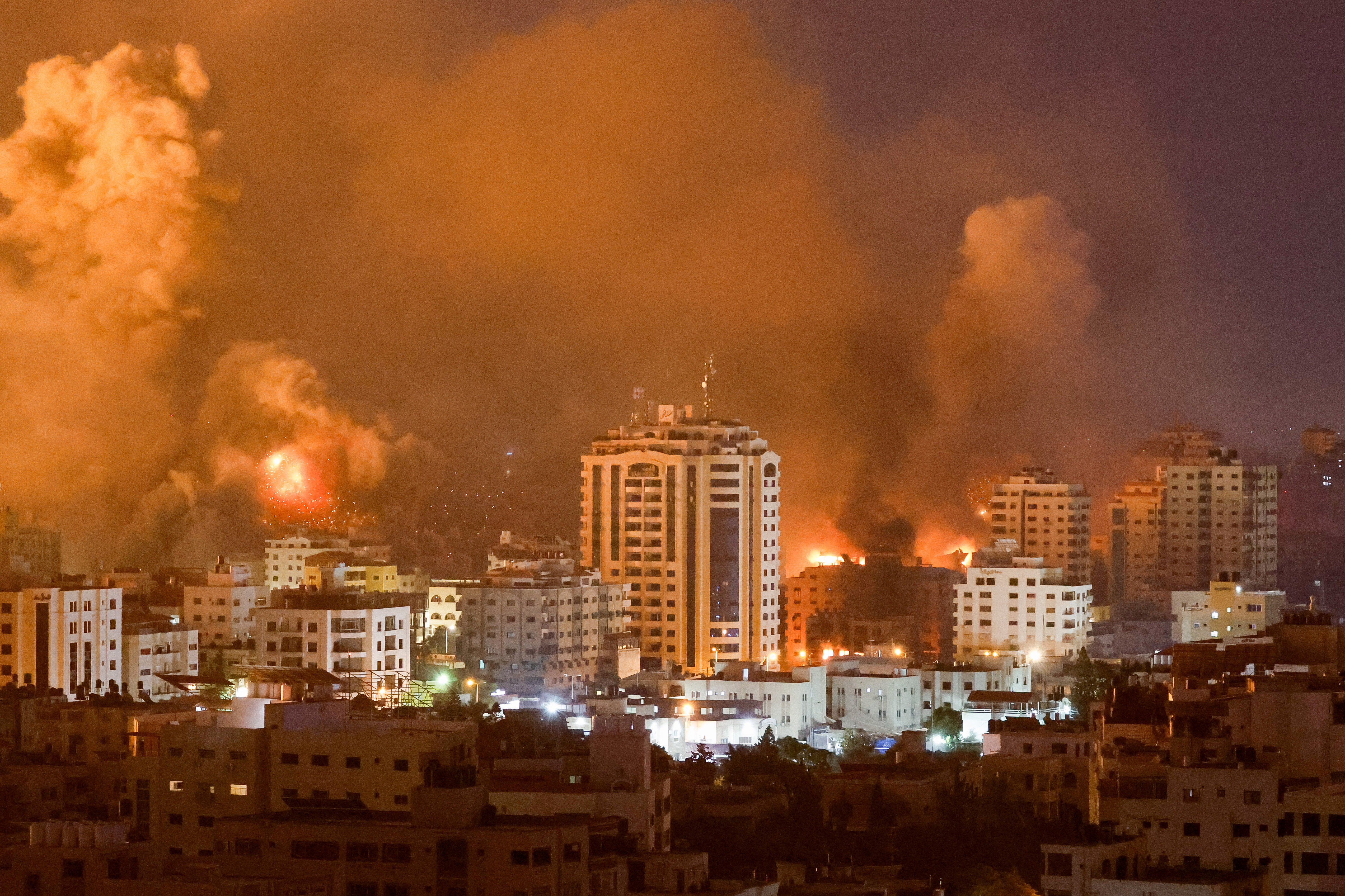 Flames and smoke billow during Israeli strikes in Gaza