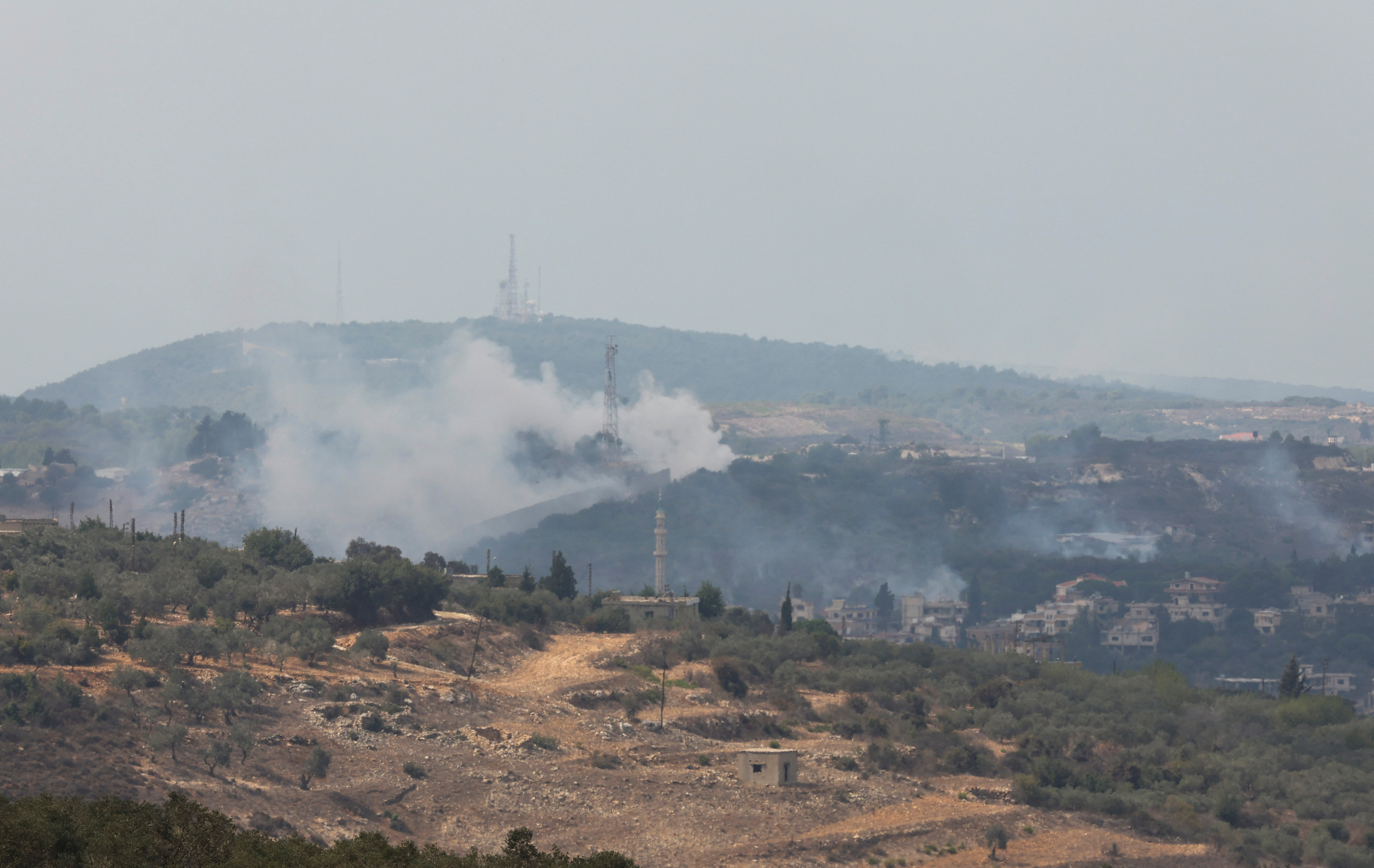 Smoke rises from Dhayra village after Israeli shelling as pictured from the Lebanese town