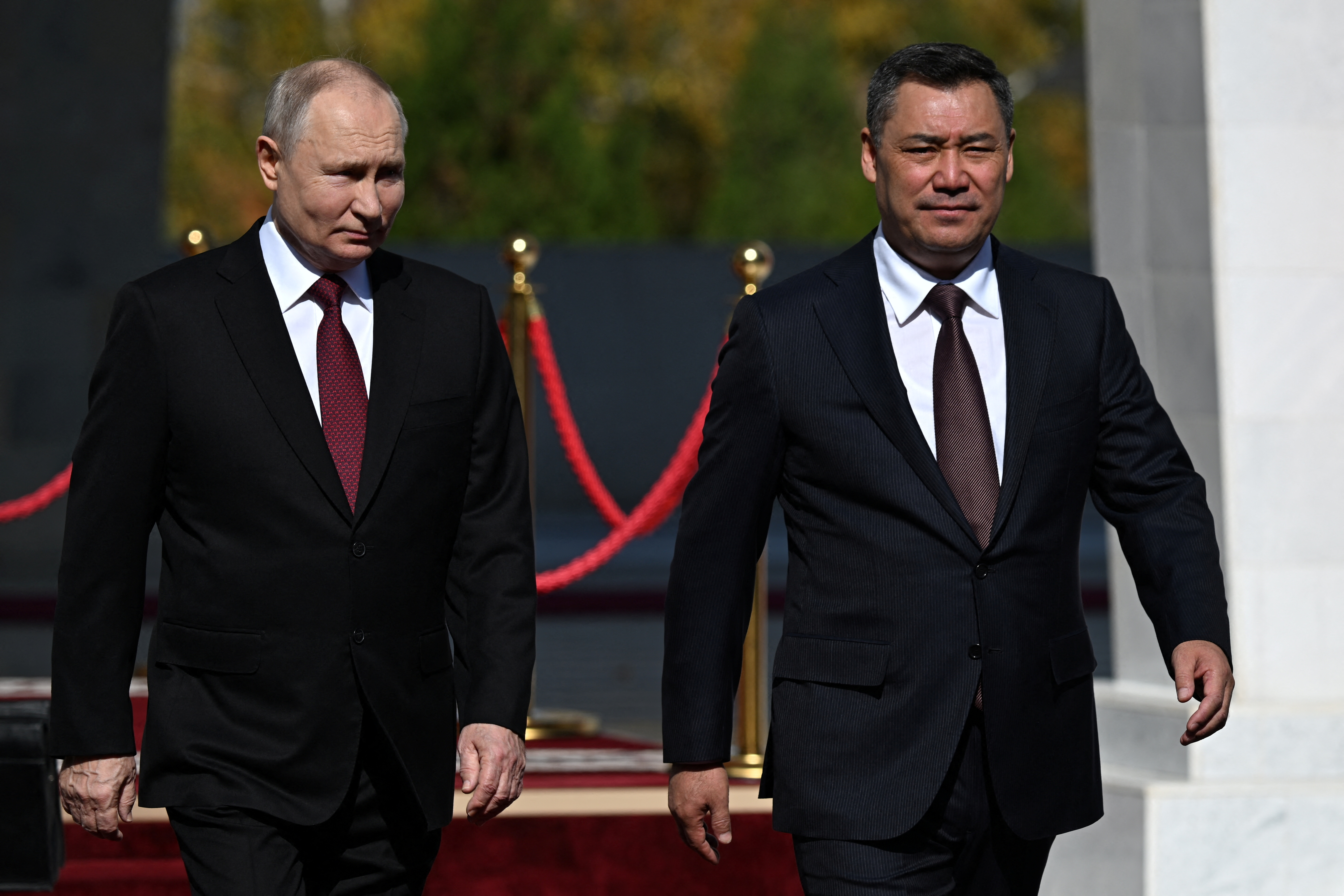 Russia's President Vladimir Putin shakes hands with Kyrgyzstan's President Sadyr Japarov