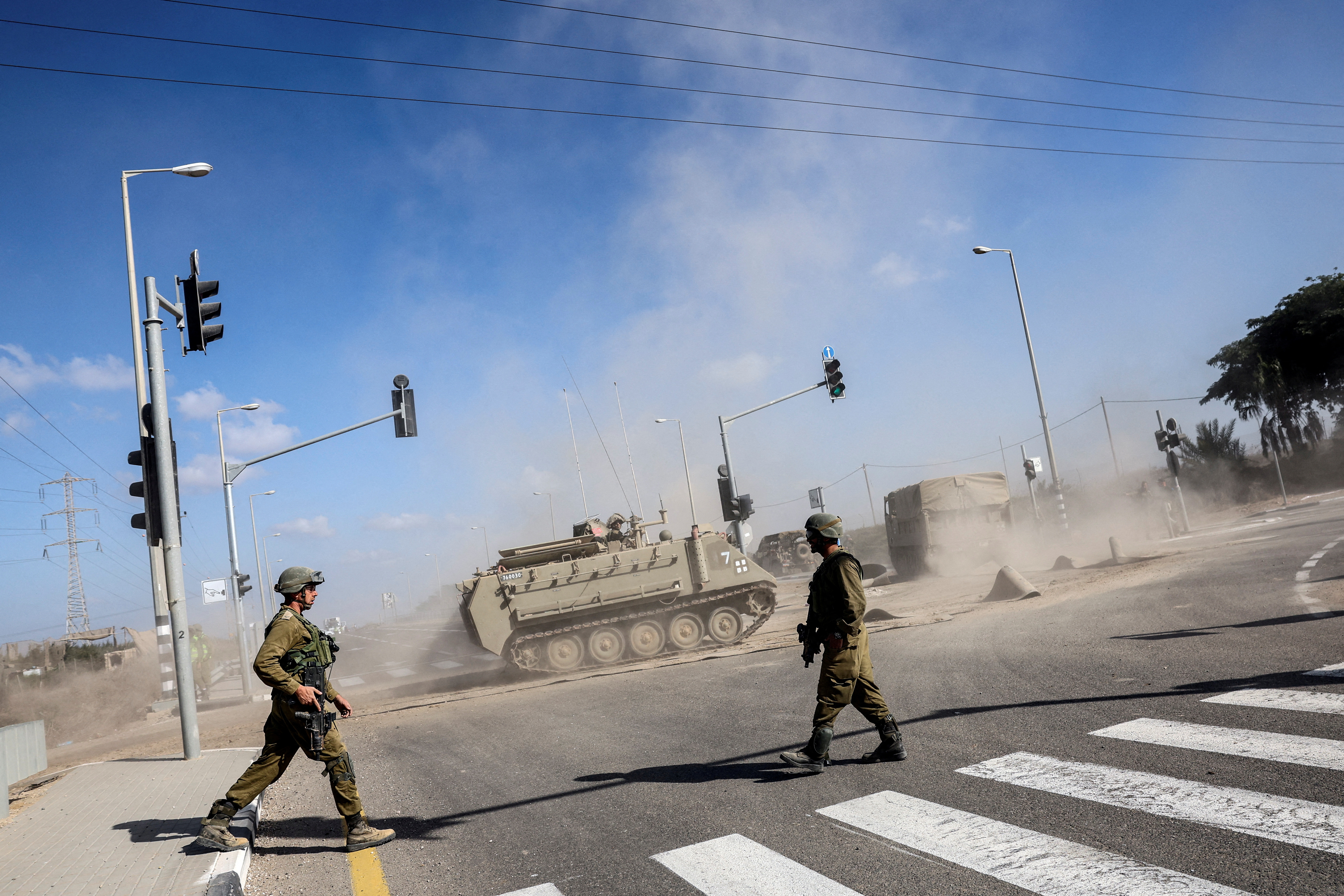 An Armoured Personnel Carrier (APC) drives near Israel's border with the Gaza Strip, in southern Israel