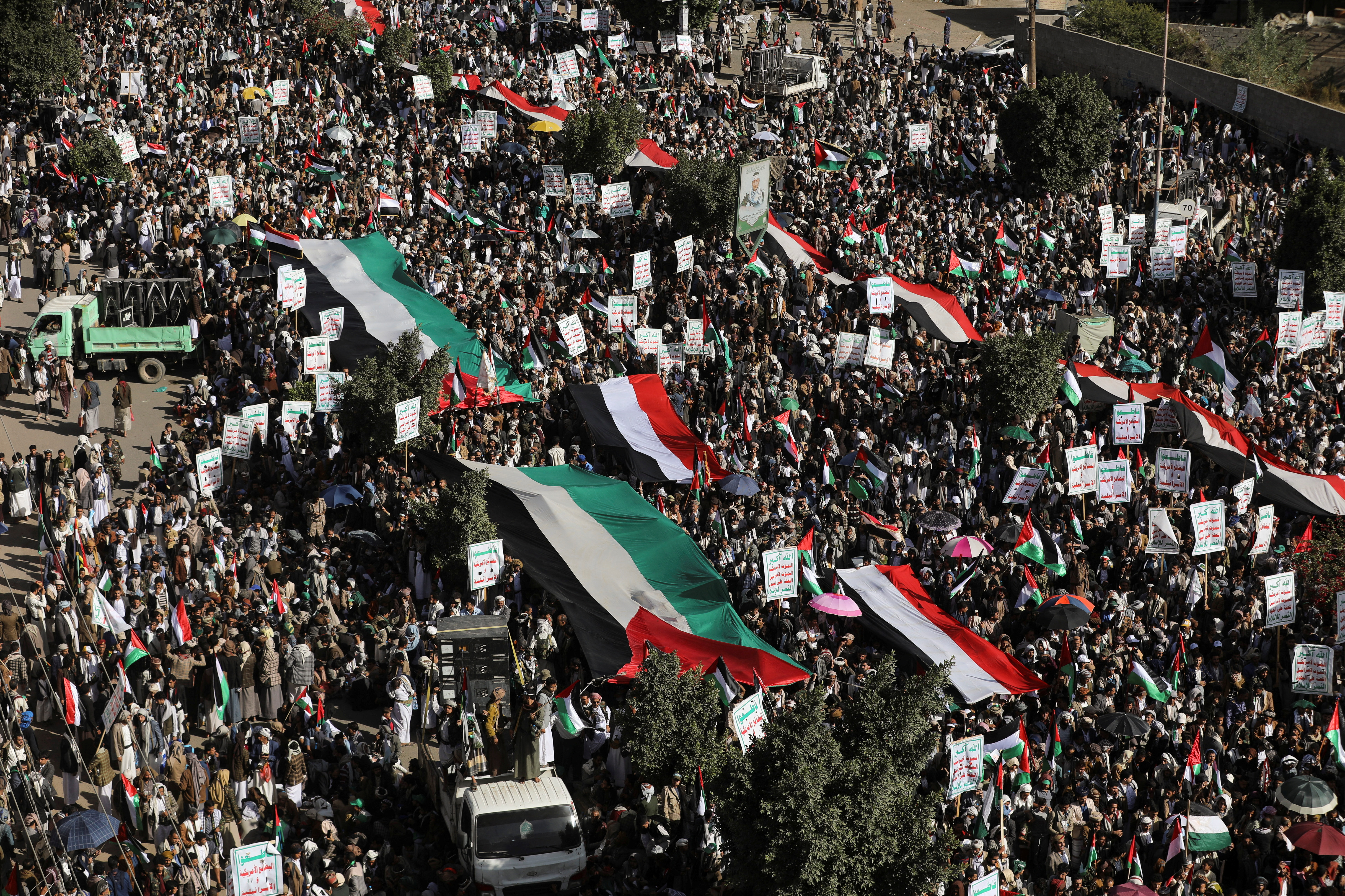 People rally to protest against the Israeli air strikes on the Gaza Strip, in Sanaa, Yemen