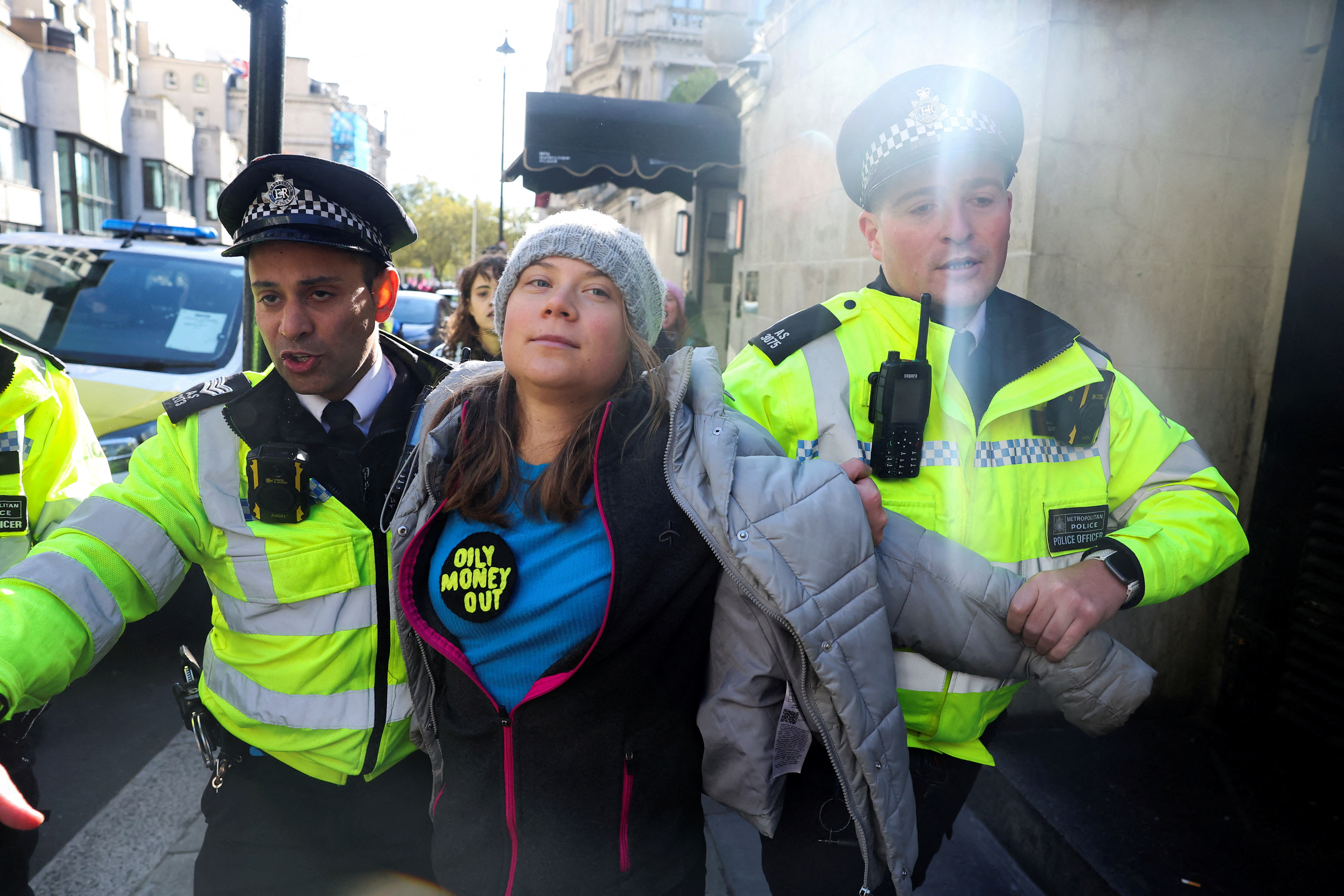 Police officers detain Swedish climate campaigner Greta Thunberg
