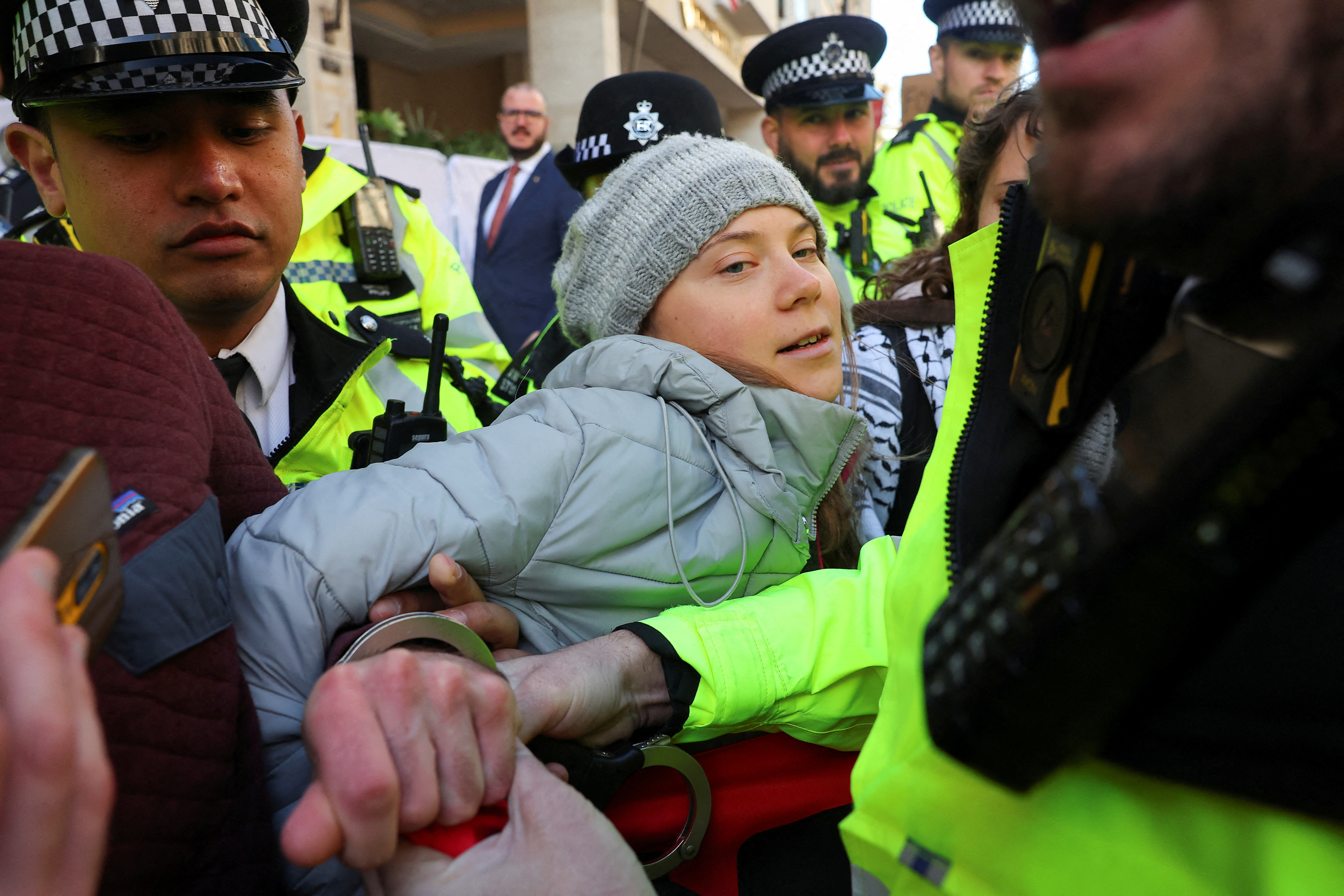 Police officers detain Swedish climate campaigner Greta Thunberg