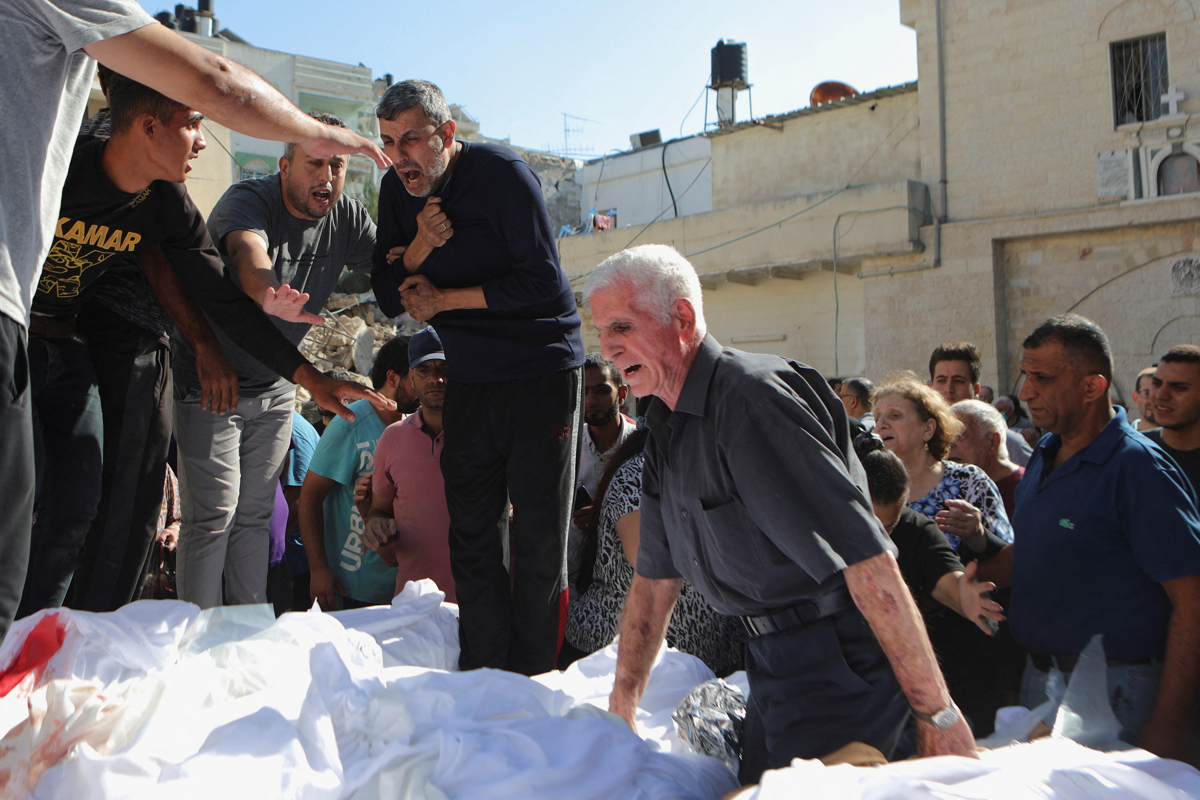 Worshippers attend a funeral at Greek Orthodox Saint Porphyrius Church, in Gaza City
