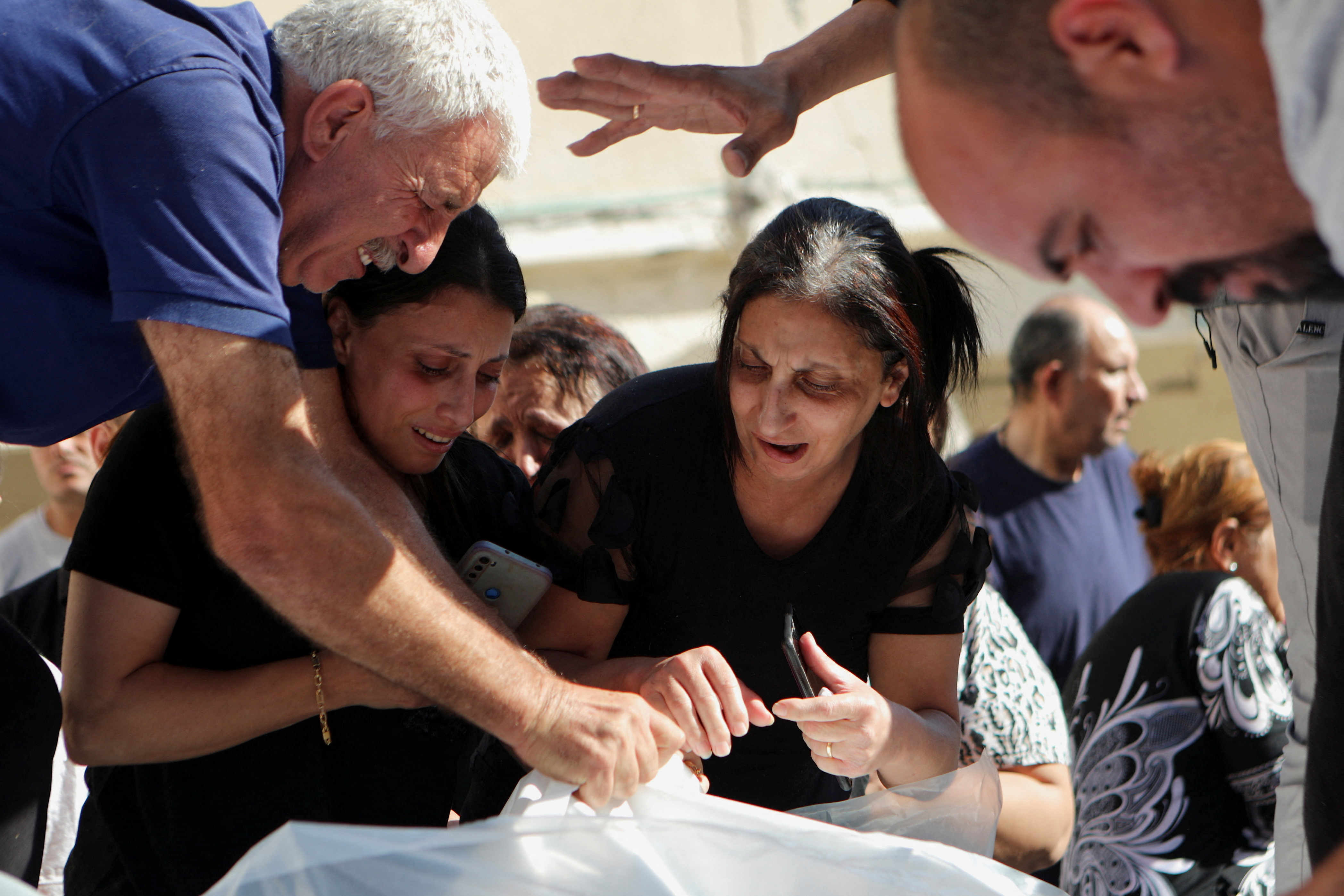Worshippers attend a funeral at Greek Orthodox Saint Porphyrius Church, in Gaza City