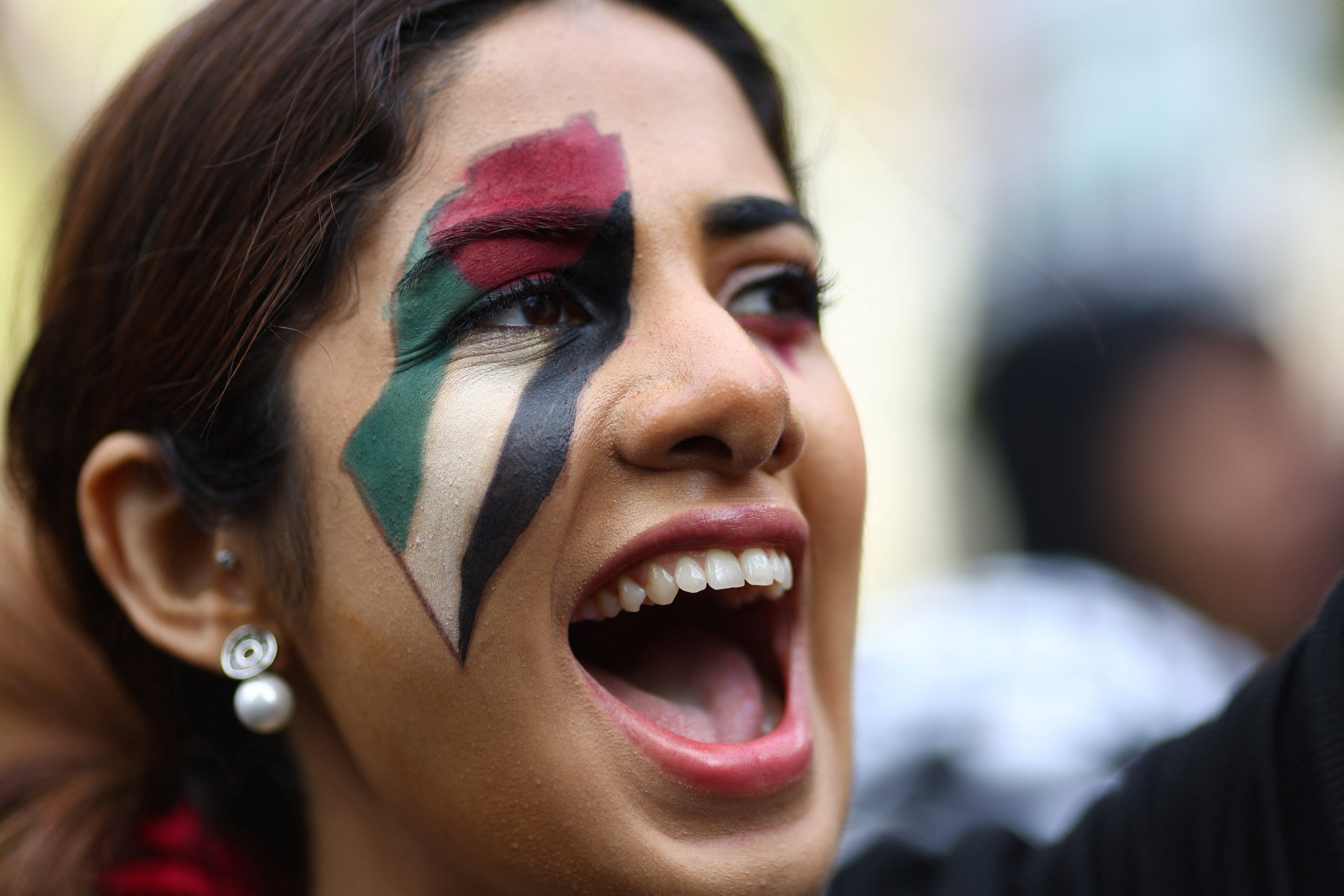 A woman yells, at a protest in solidarity with Palestinians in Gaza, amid the ongoing conflict between Israel and the Palestinian Islamist group Hamas, in London